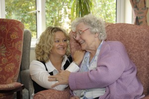 Admiral Nurse talking to an older woman in a Friends of the Elderly residential care home