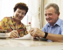 Elderly couple writing personalised care plan