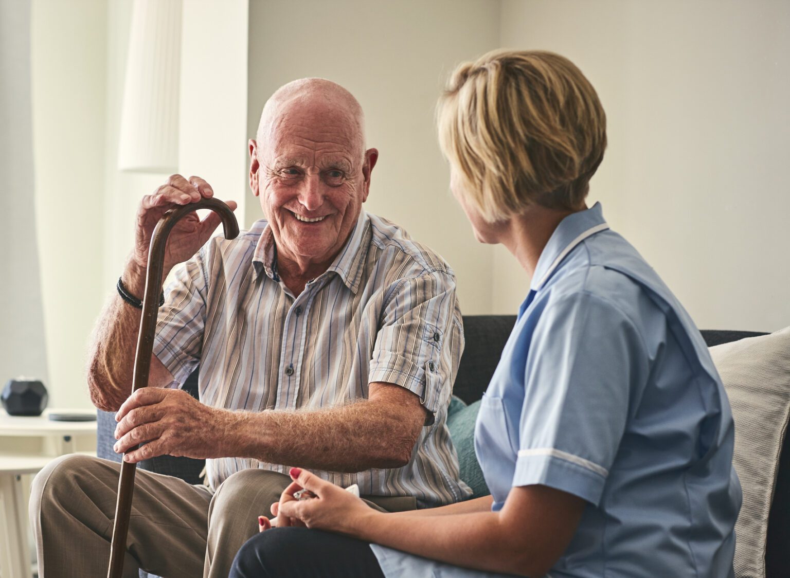 Care home resident with care worker