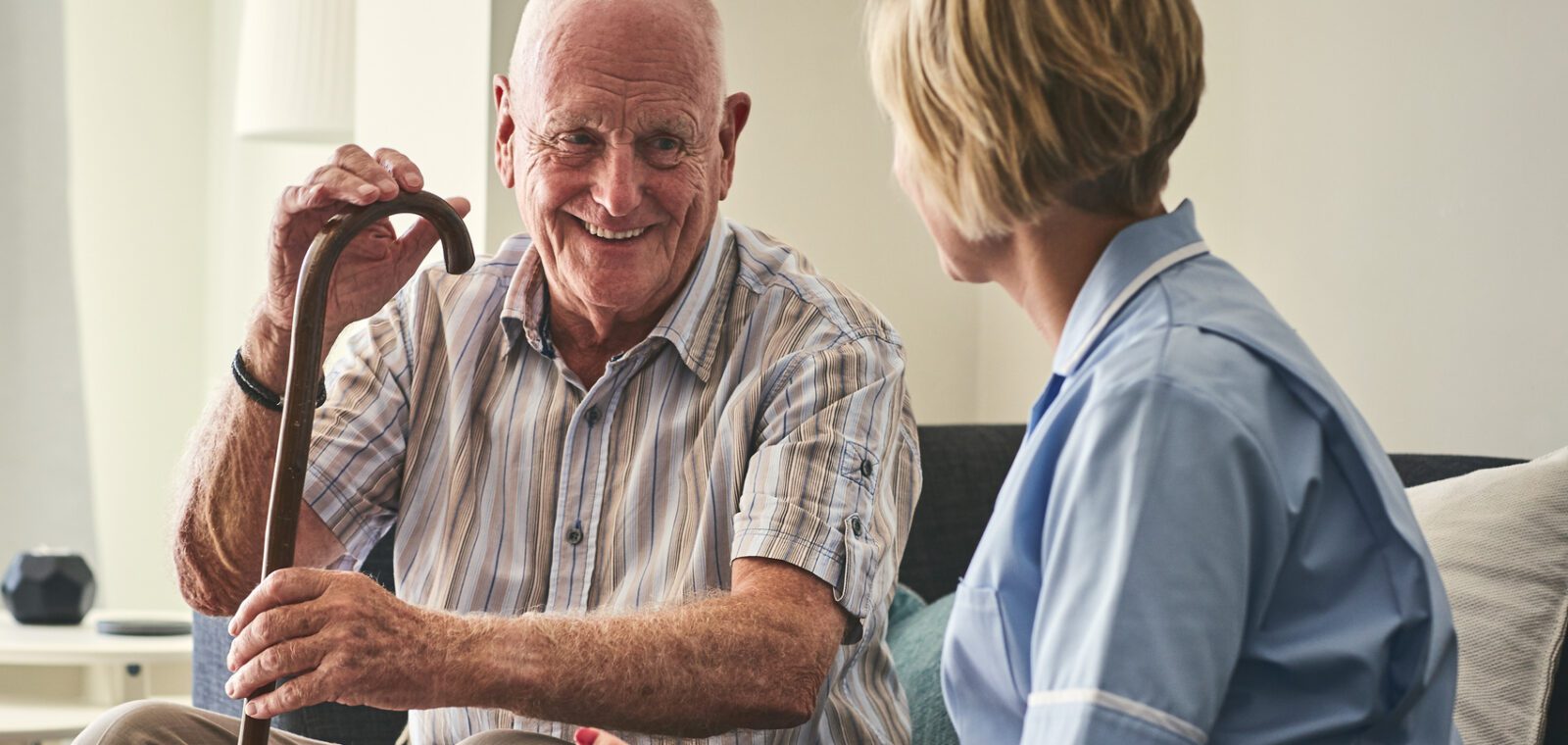 Care home resident with care worker