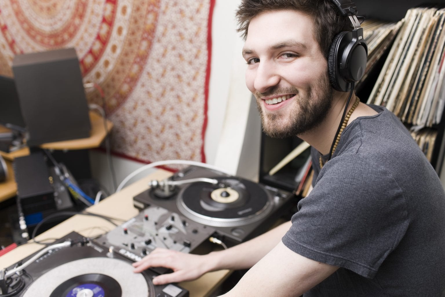 Caucasian Young Man DJ in Music Studio Wearing Headphones, Copyspace