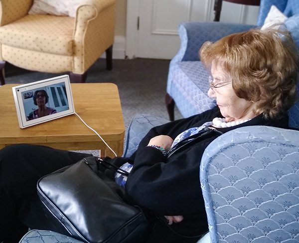 Resident Grace speaking with her daughter during a video call