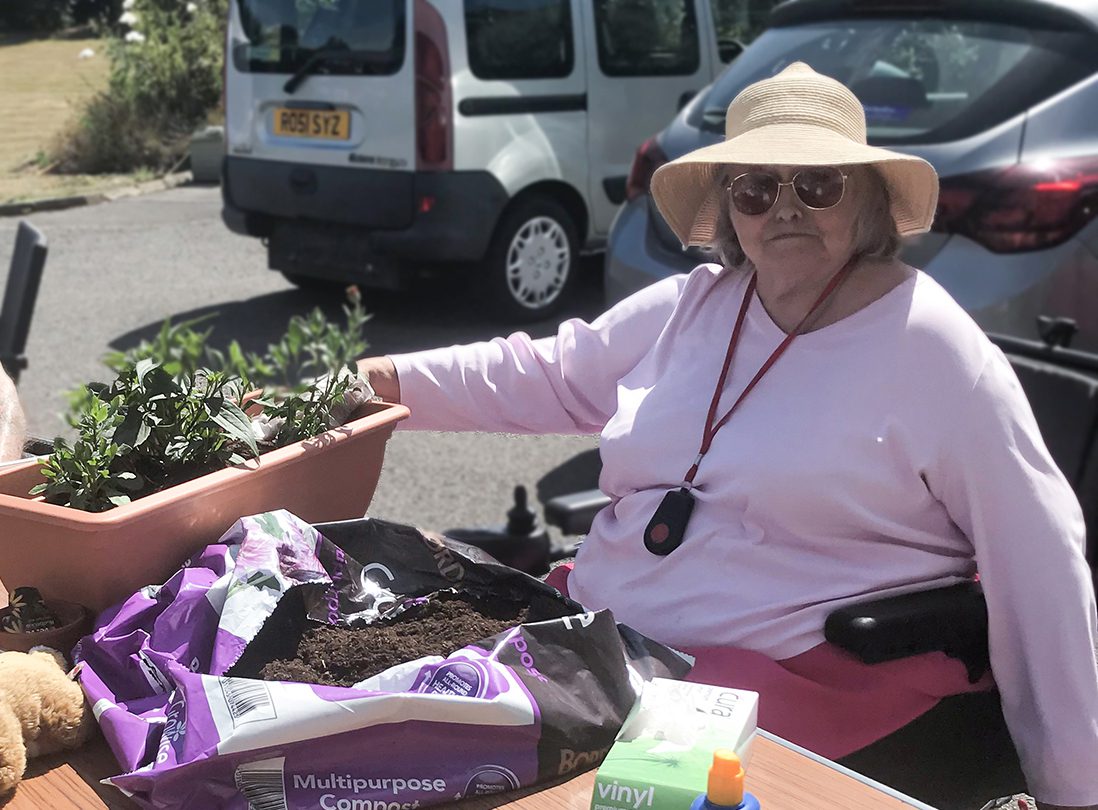 A Bournemouth resident sat in the sun and potting plants 