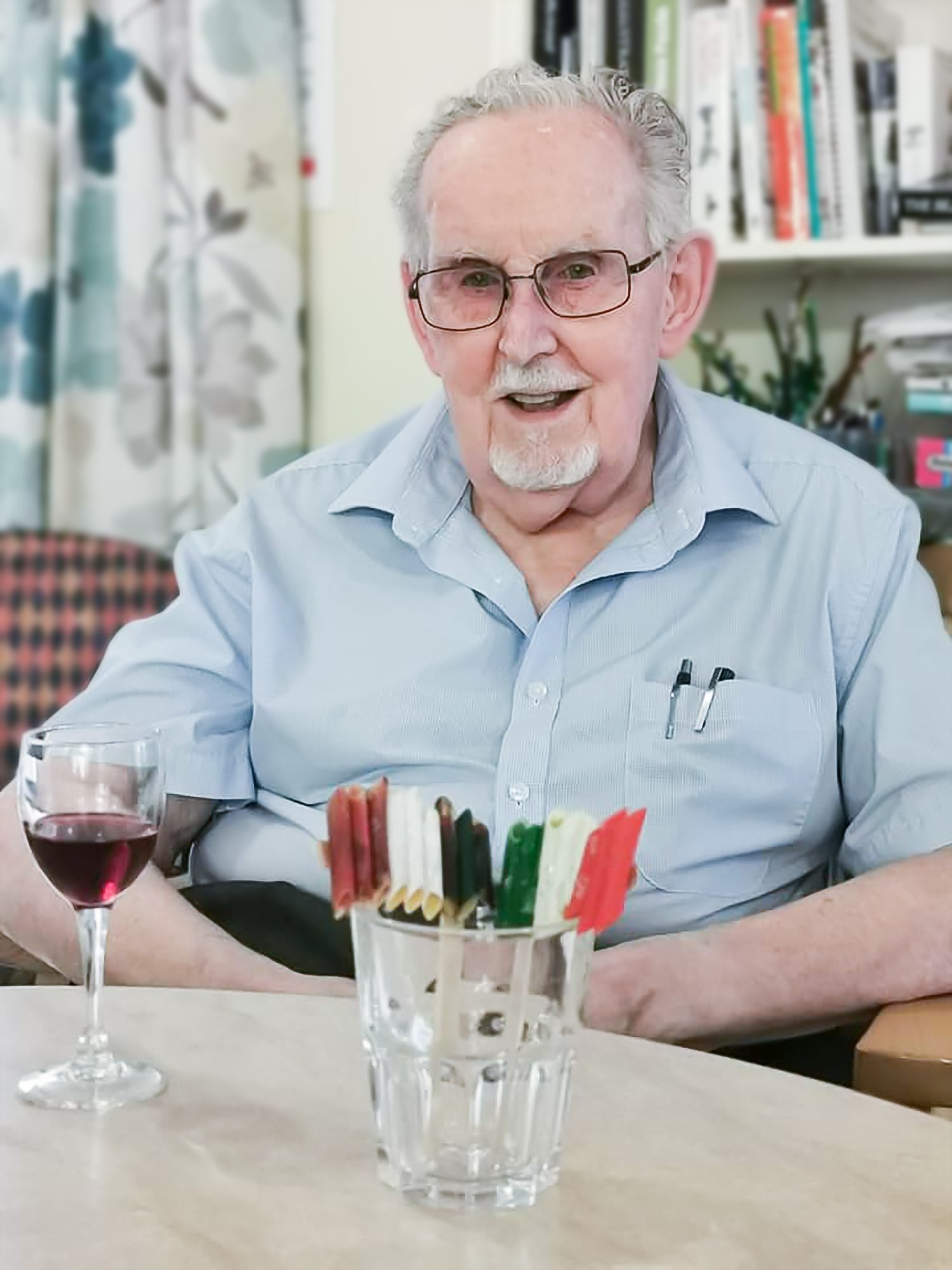 A resident enjoying wine with an Italian flag