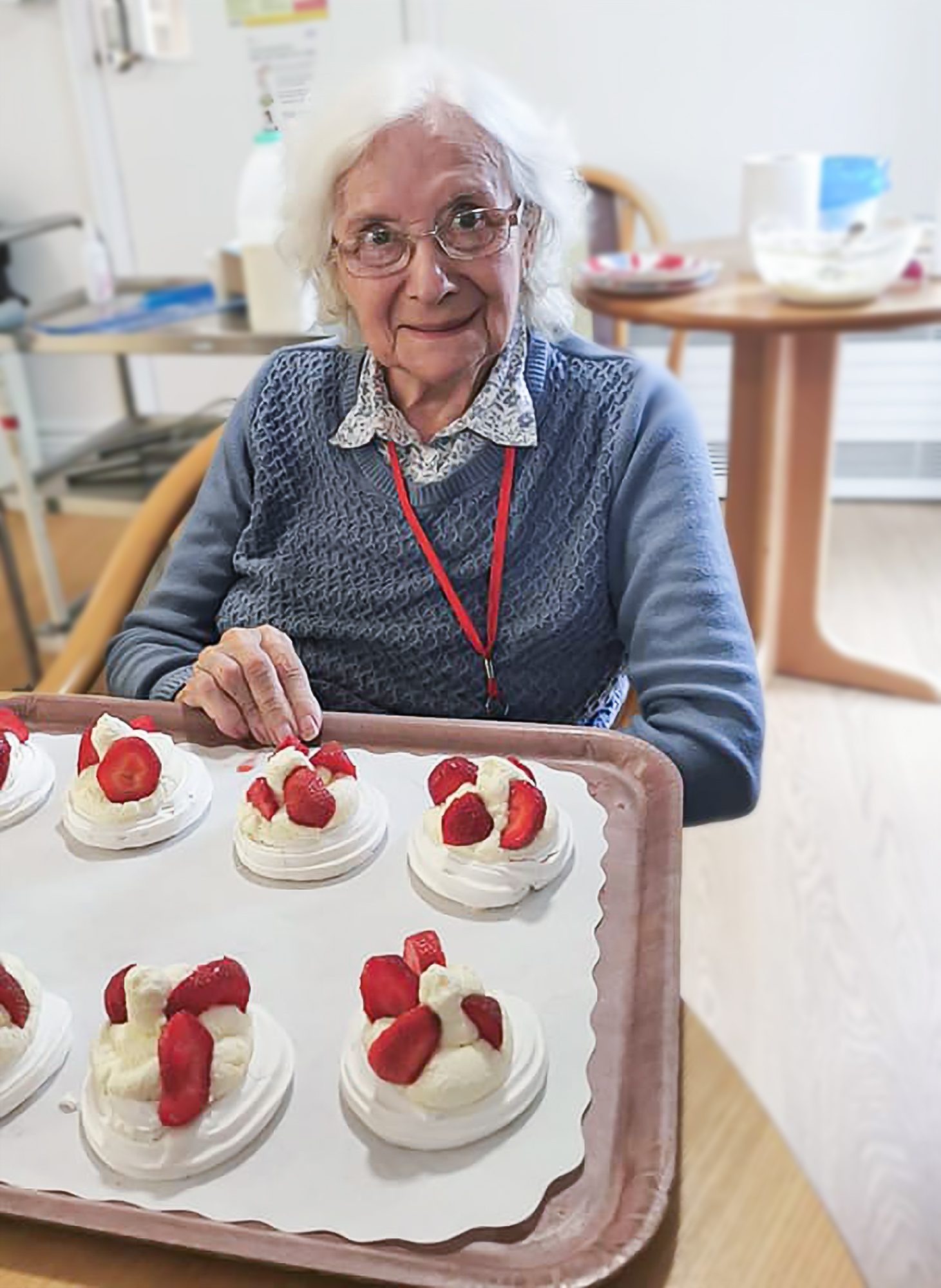 A care home resident making pavlova