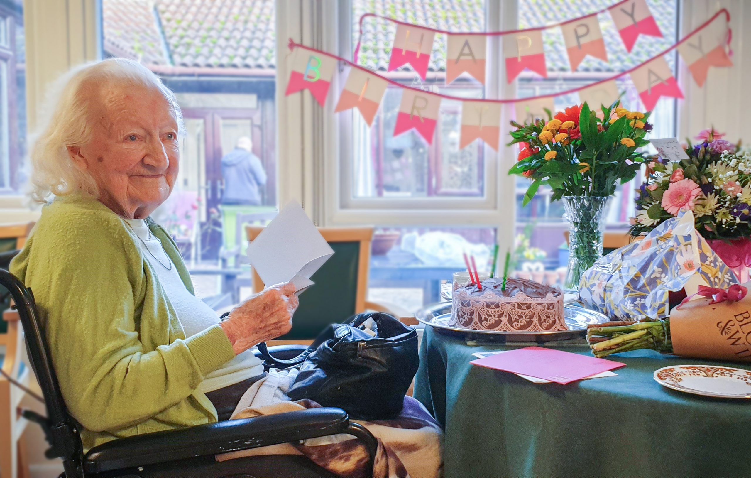 Essex resident Marjorie Wood celebrating her landmark birthday surrounded by cake and presents. 