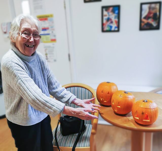 A resident with carved pumpkins