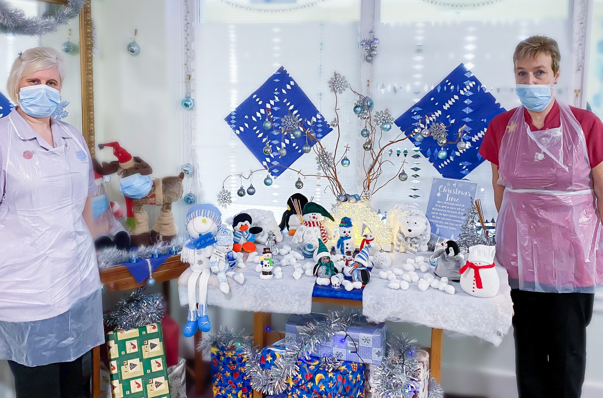 Vanda and Dawn stood together with their Christmas display table at Perrins House