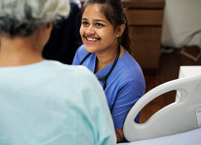 Cheerful nurse with resident