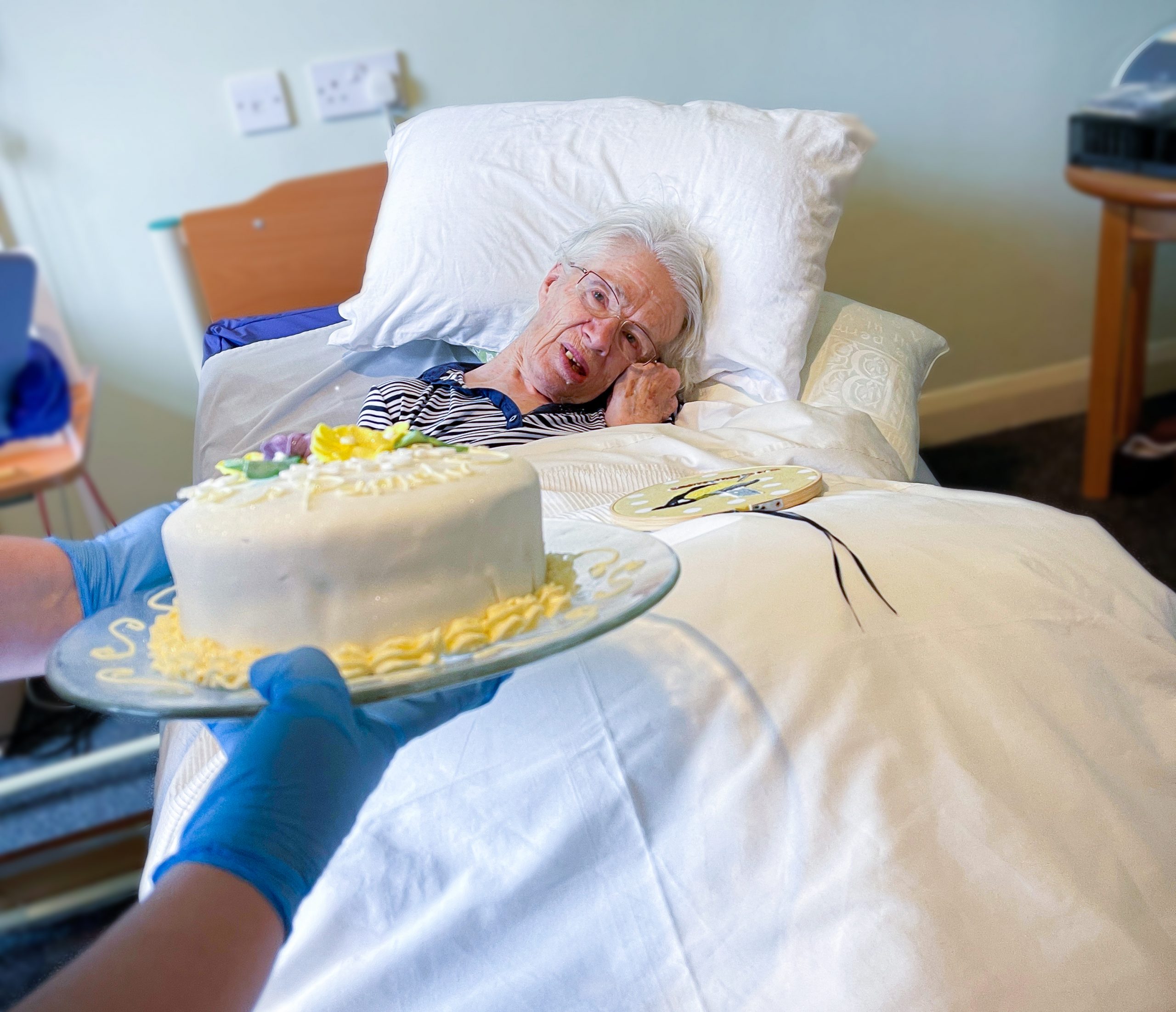 Pamela receiving her birthday cake