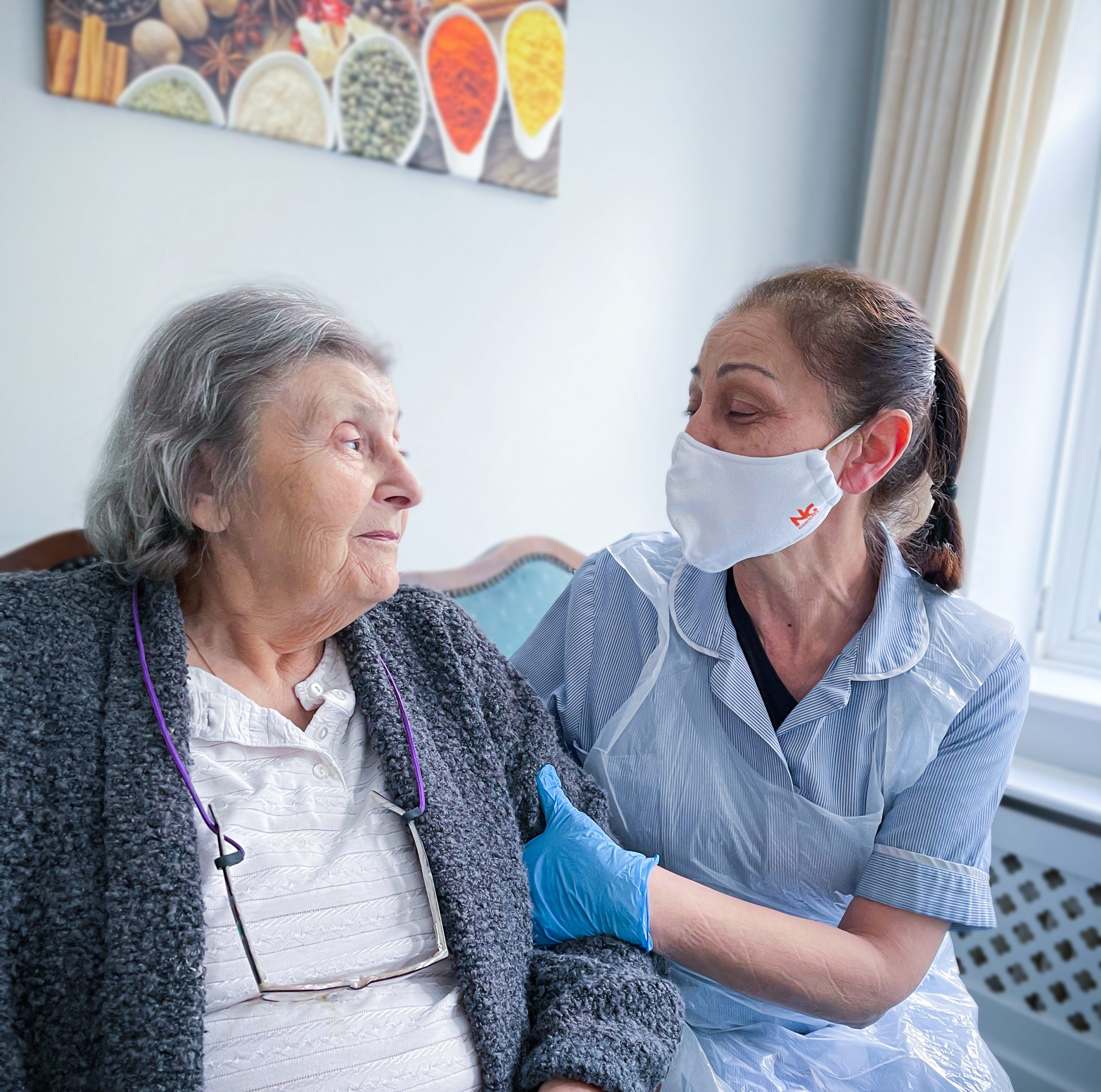 Dementia Champion Lana smiling with a Redcot resident 