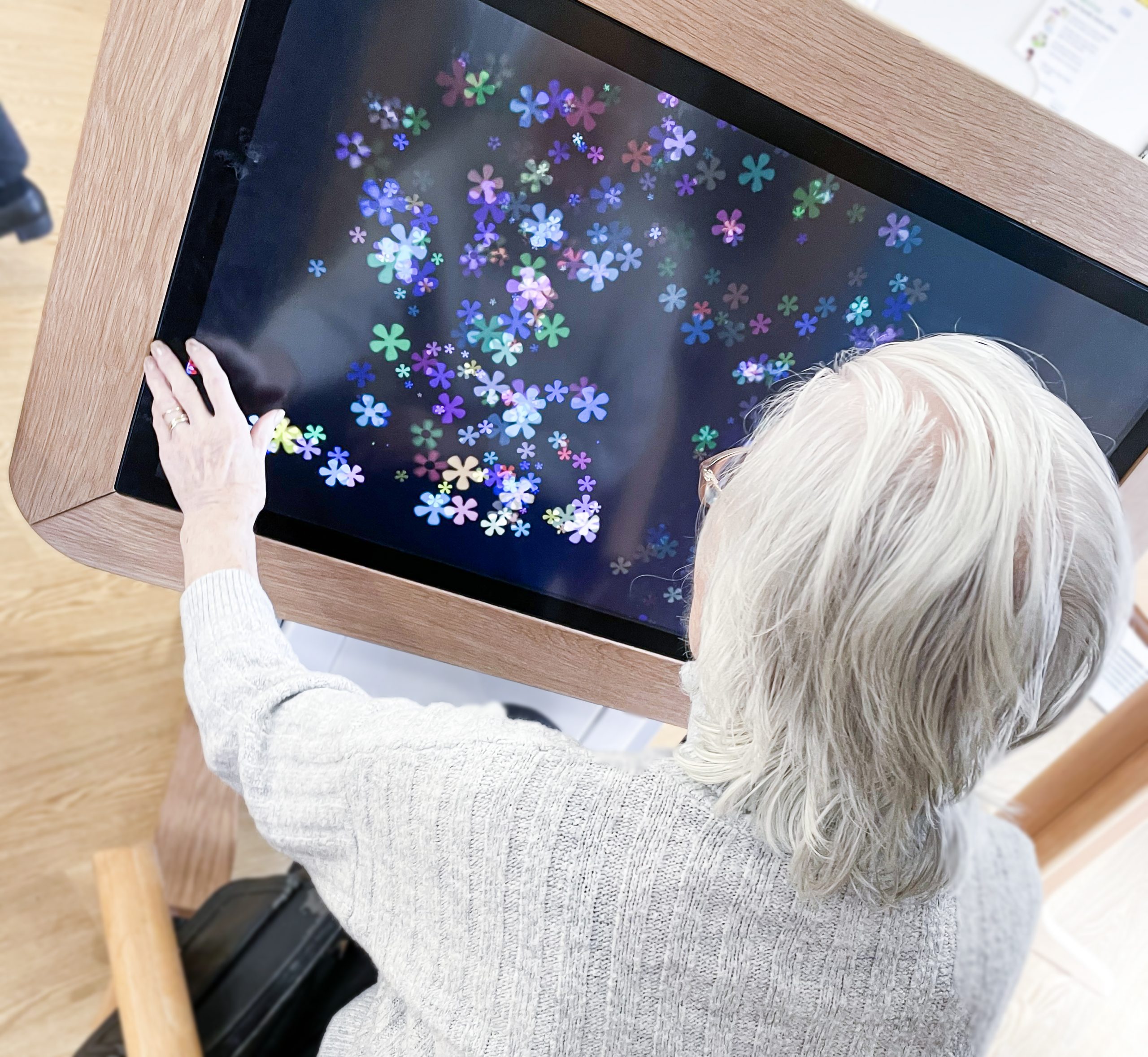 Bernard Sunley resident using the interactive Rainbow Table