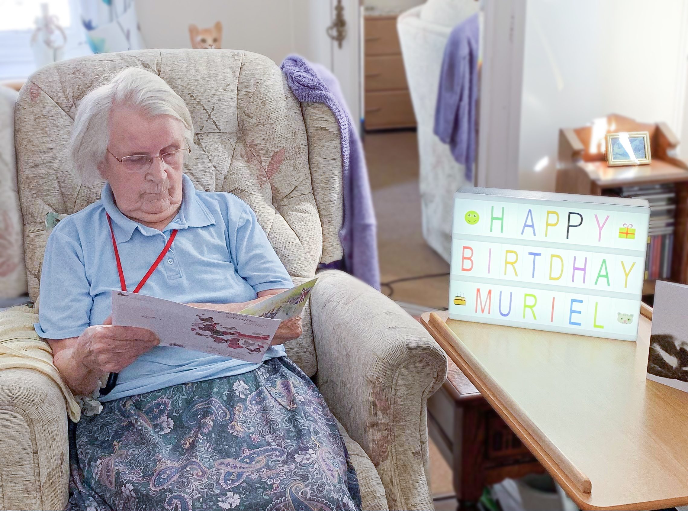 Muriel reading a birthday card