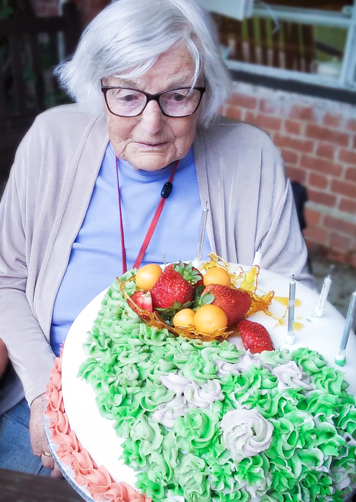 Alton resident Betty Marlow with a cake on her 100th birthday.