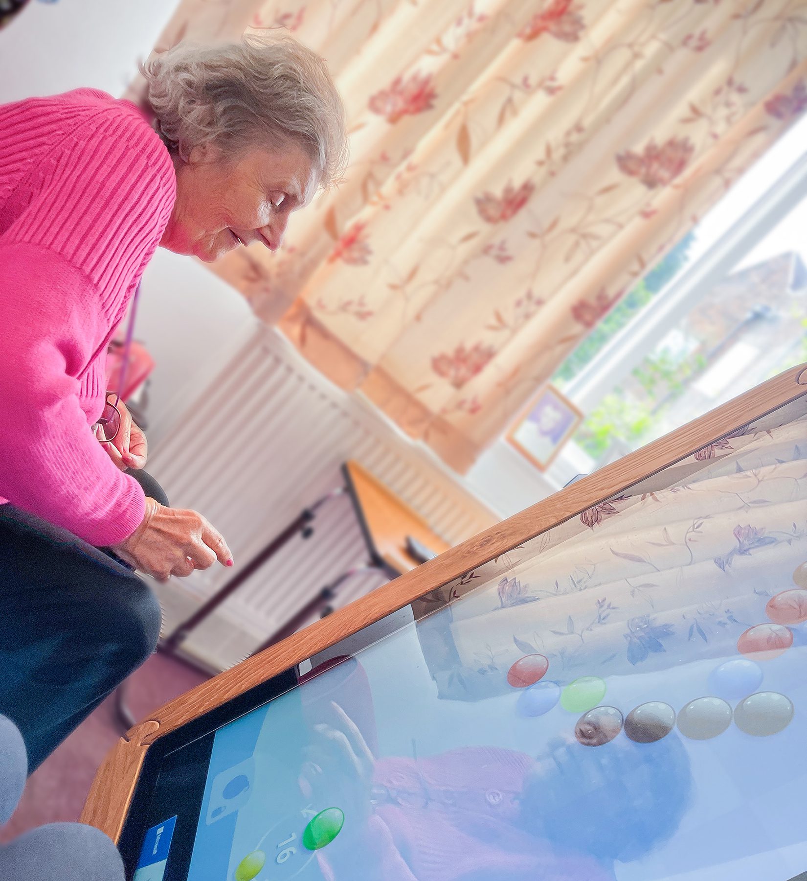 A resident using an interactive table