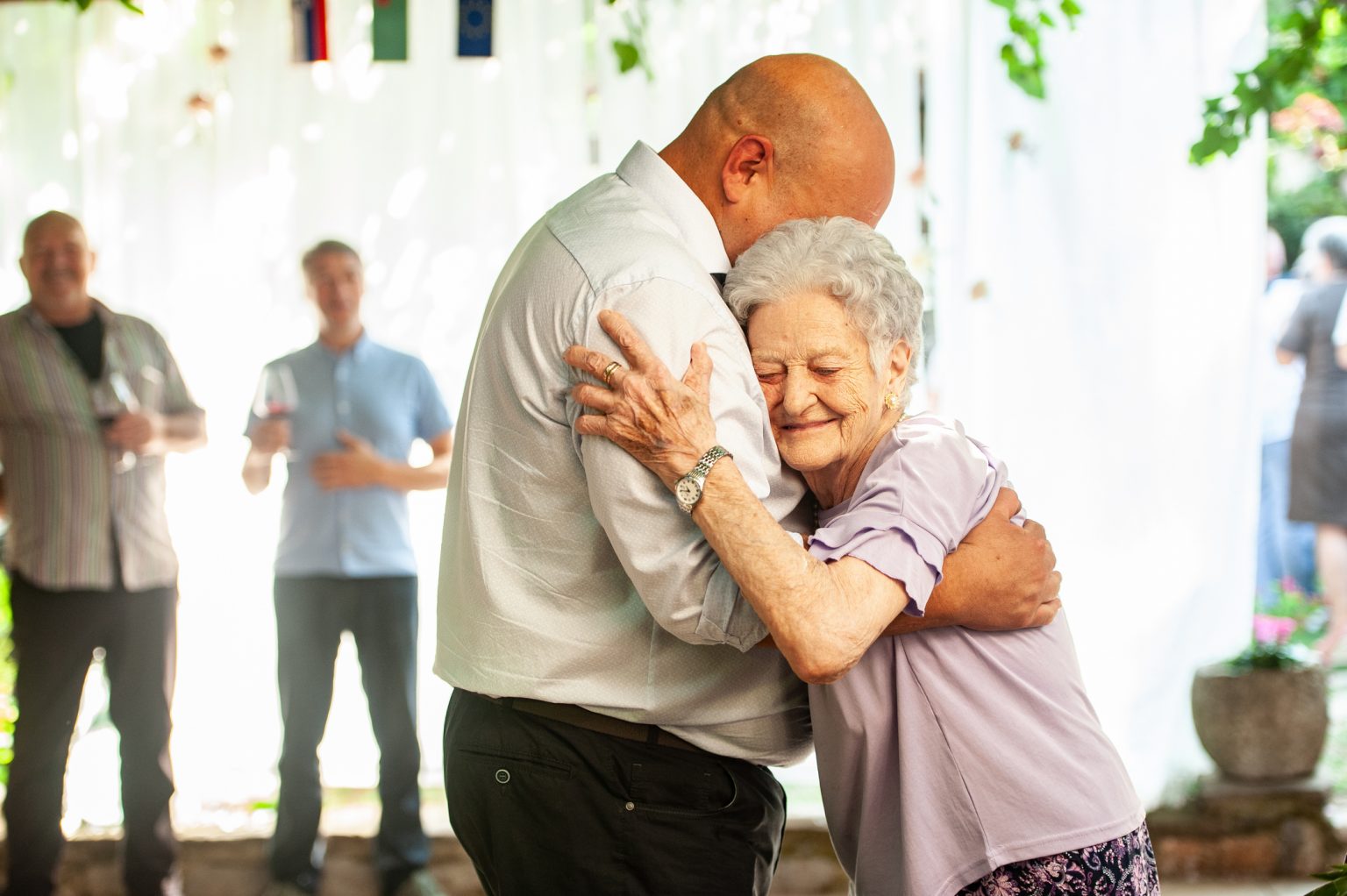 Adult Man Hugging His Senior Mother at his Wedding