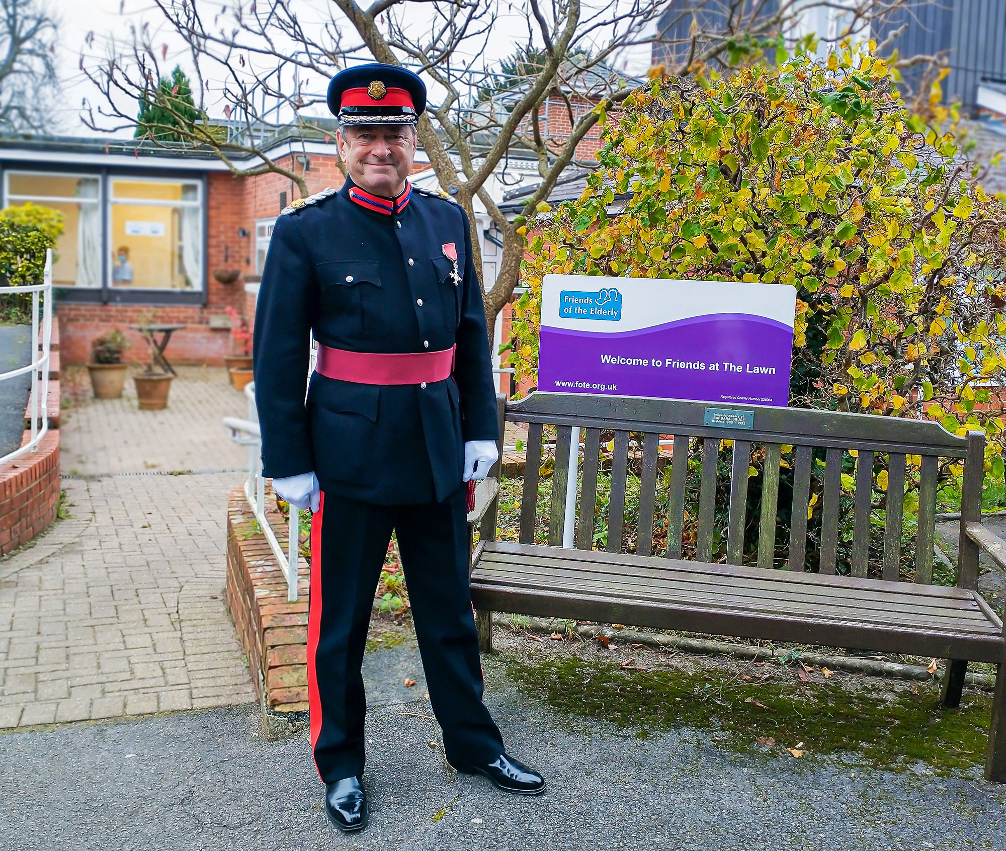 December highlights - Alan Titchmarsh stood outside of The Lawn care home