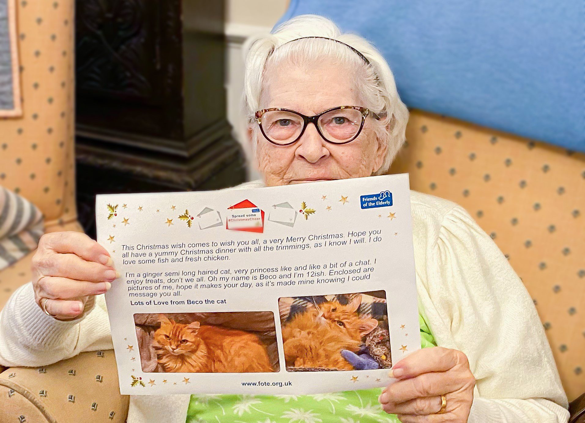 December highlights - a resident holding a #ChristmasCheer message