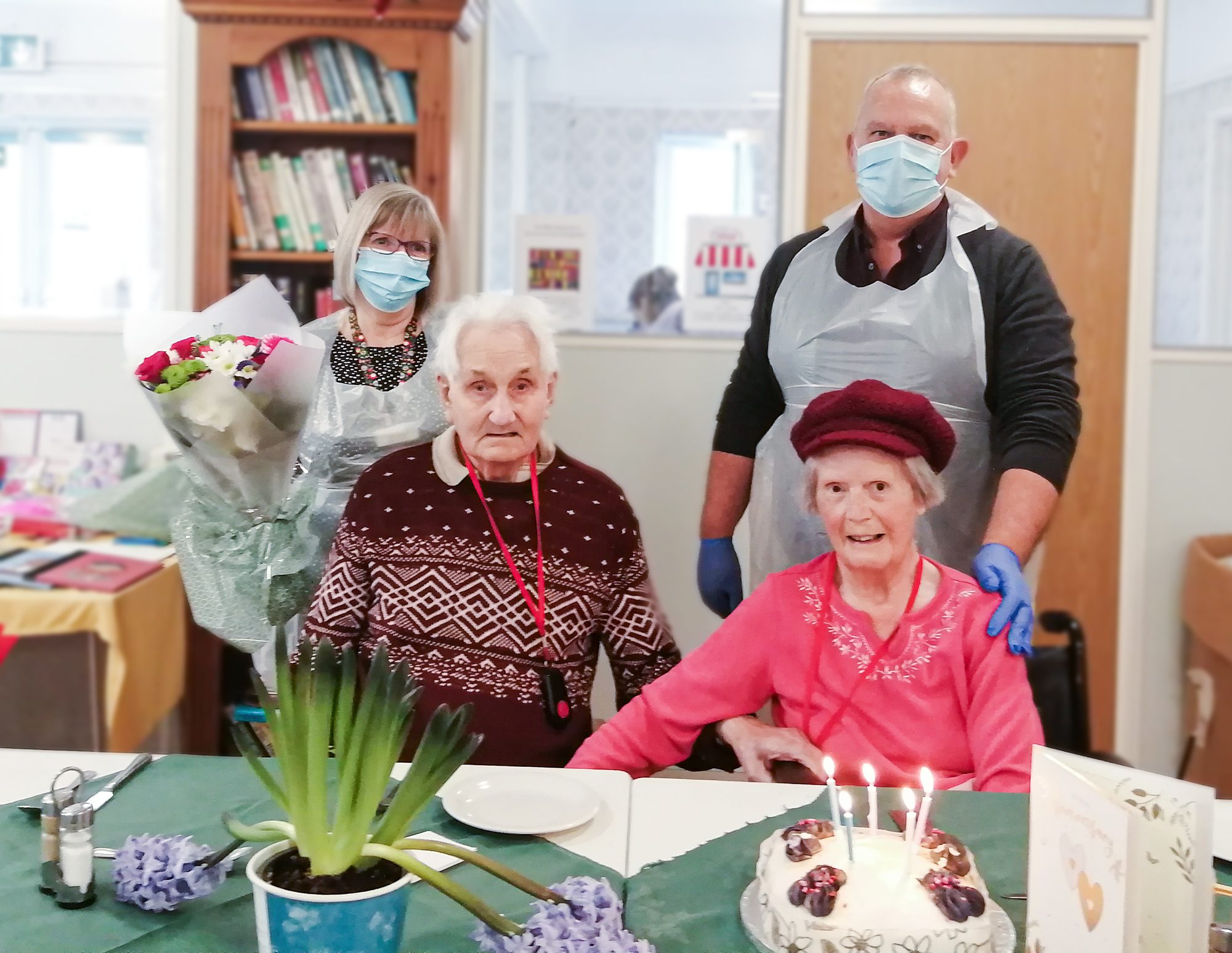Len and Delia on their anniversary sat with Care Home Manager Alan Johnston and Deputy Manager, Ruth Arnold