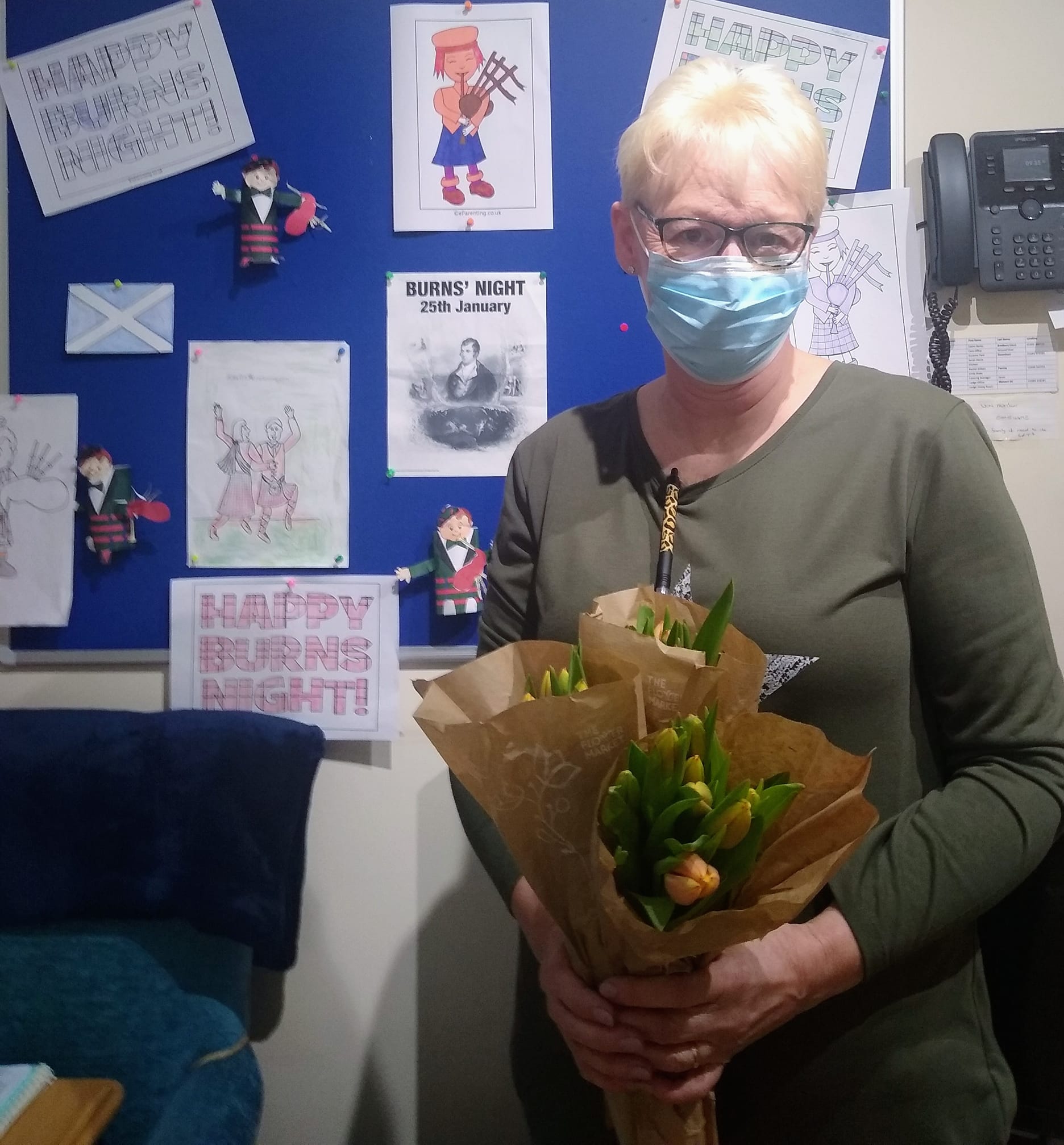 Lynn holding flowers