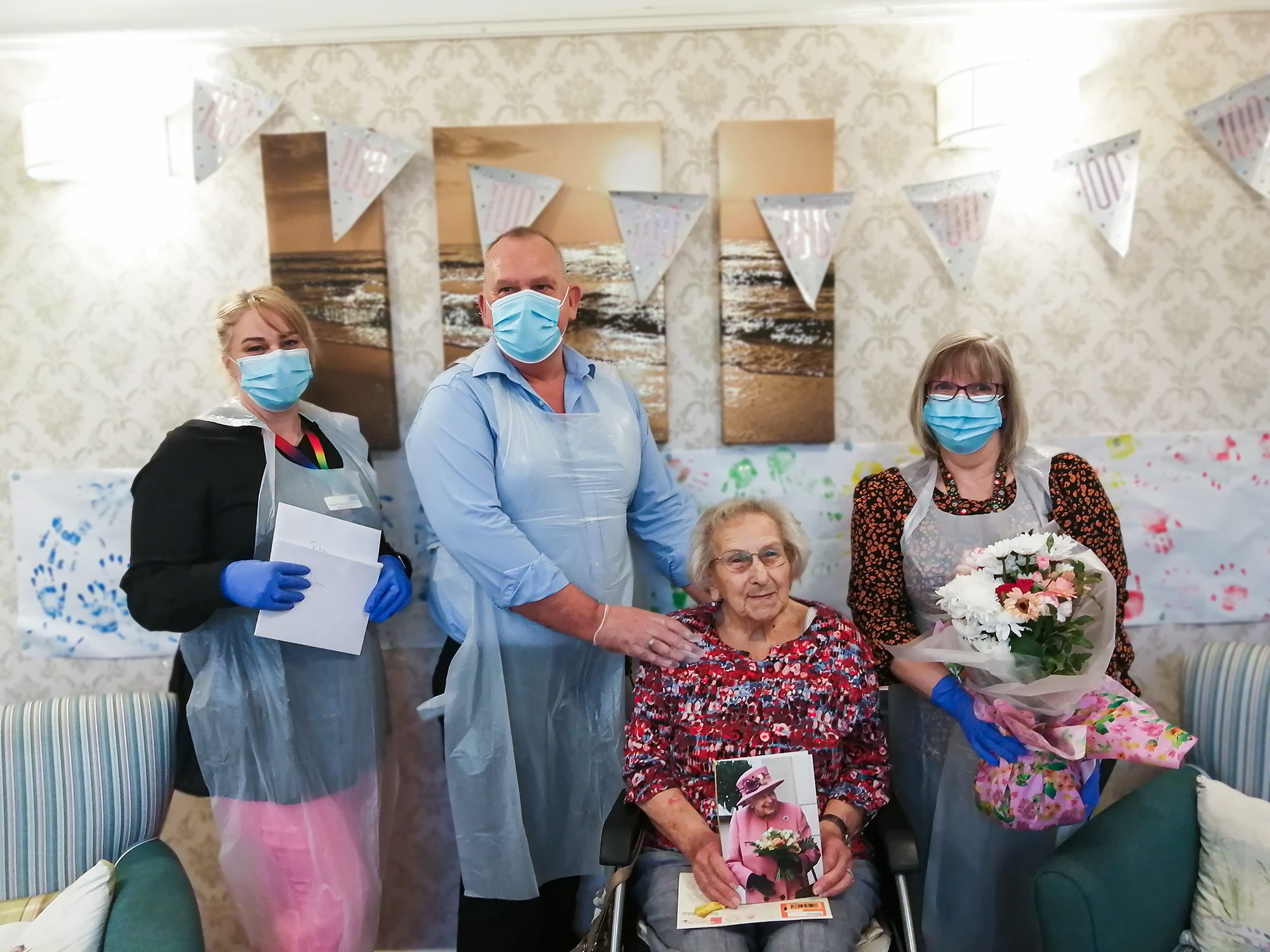 Rita on her 100th birthday with RNNH care home staff