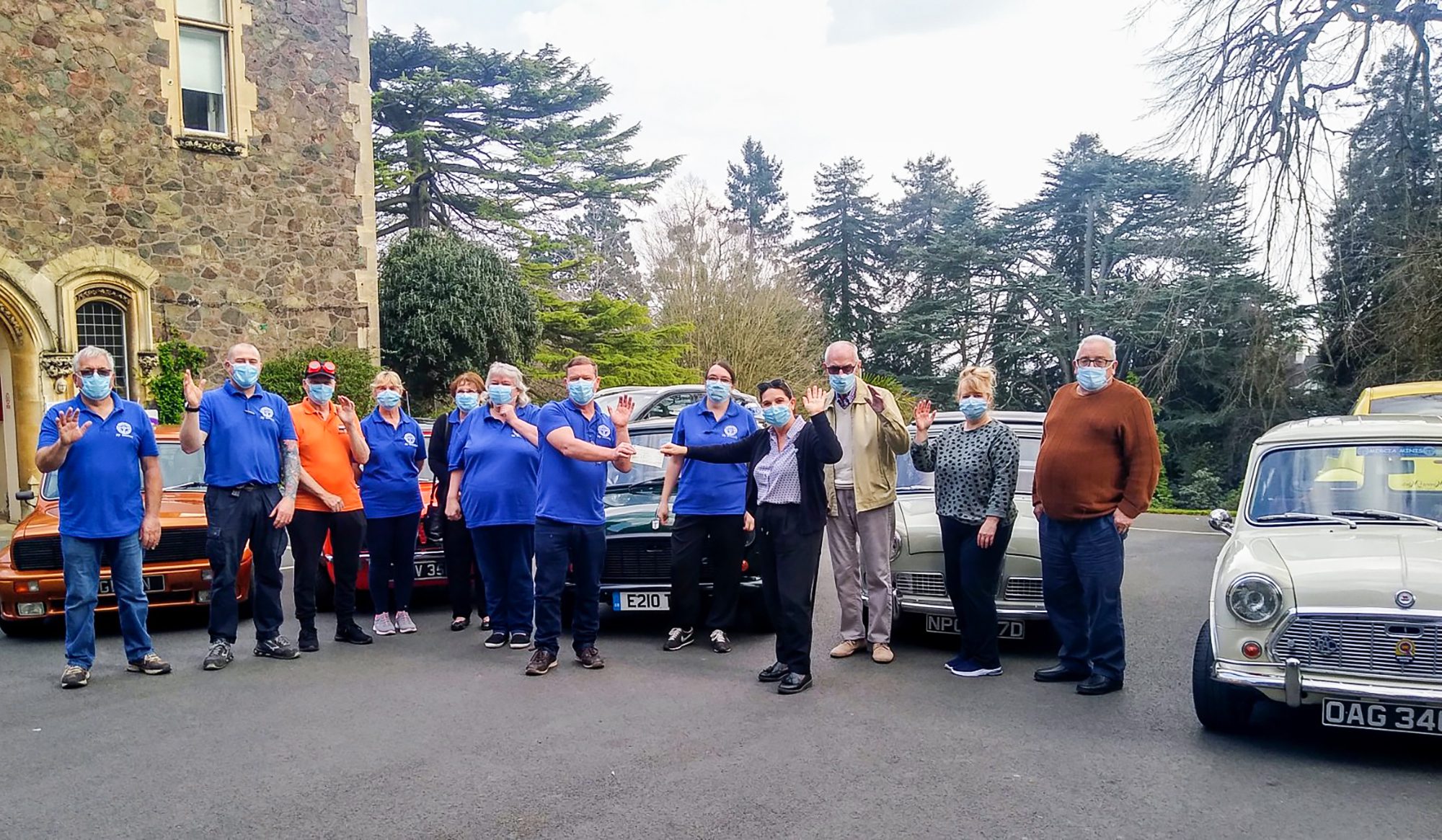 Mercia Malvern Minis Car Club presenting a cheque at Malvern Day Care