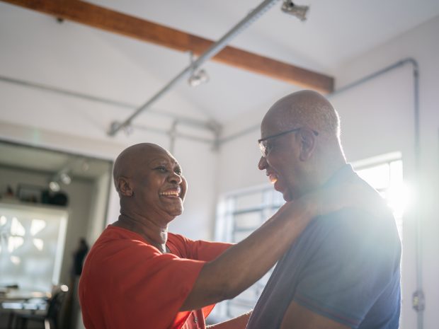 Older couple embracing and smiling