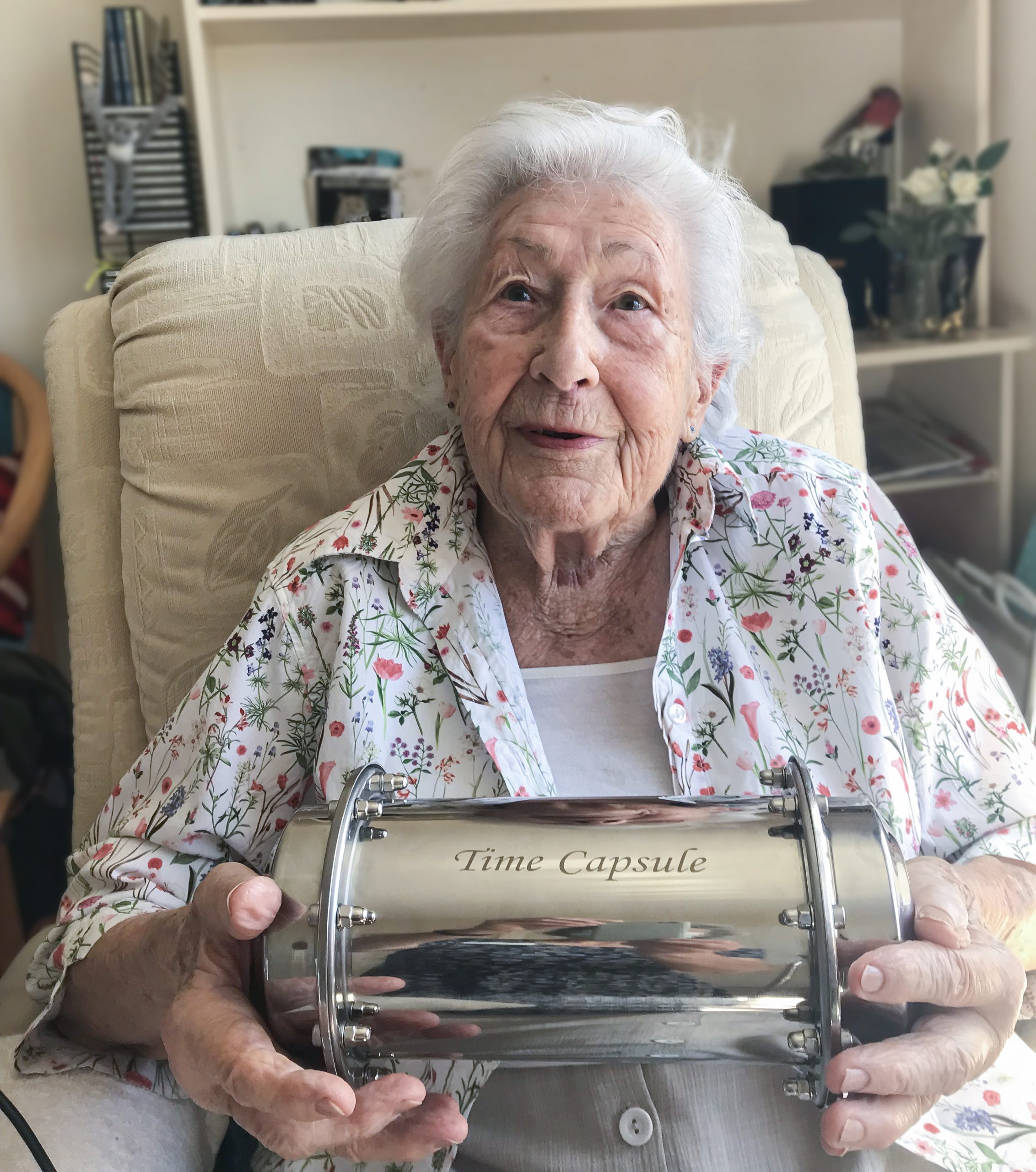 A Redcot resident holding their time capsule