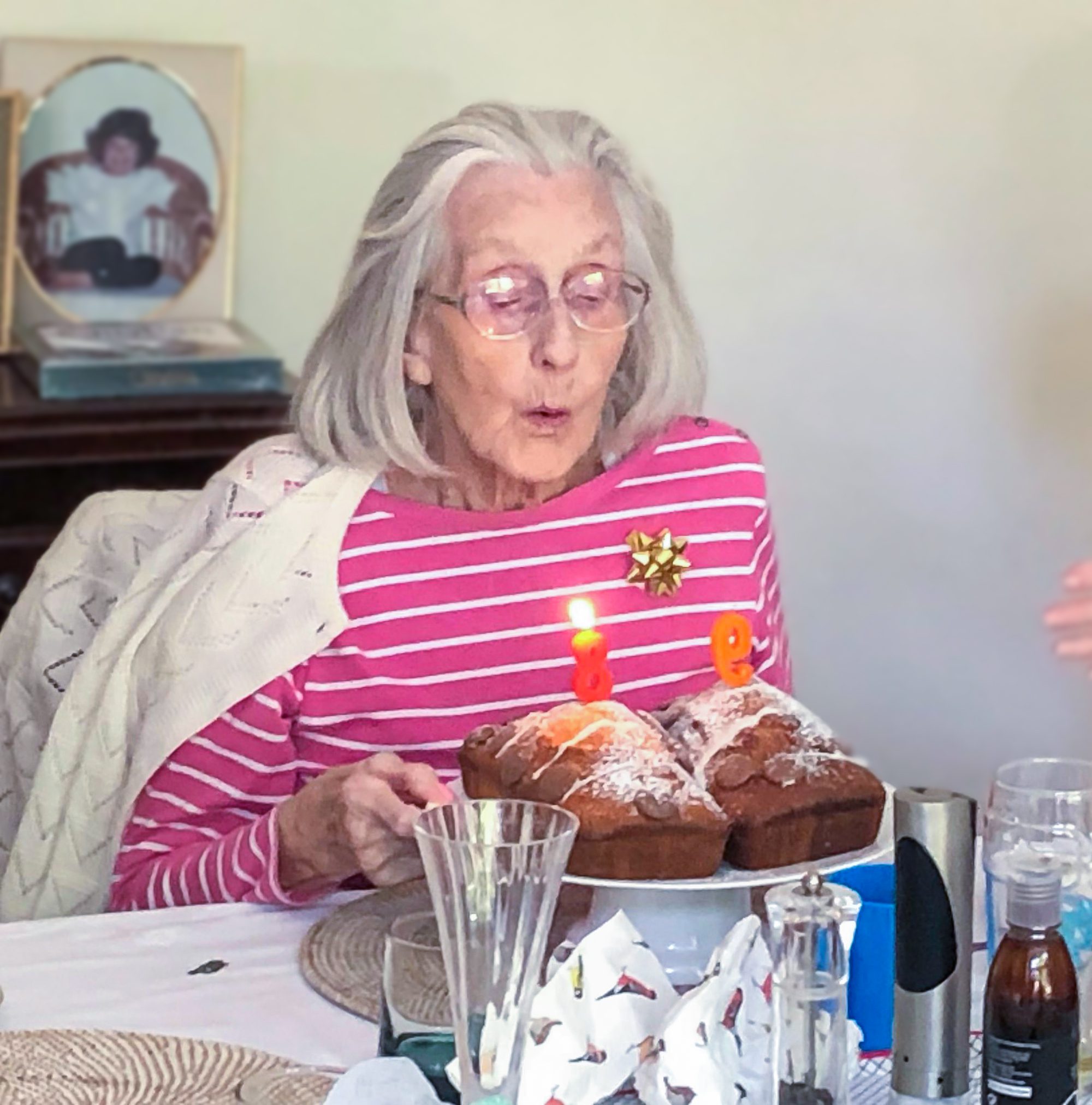 Dora blowing out candles on her cake.