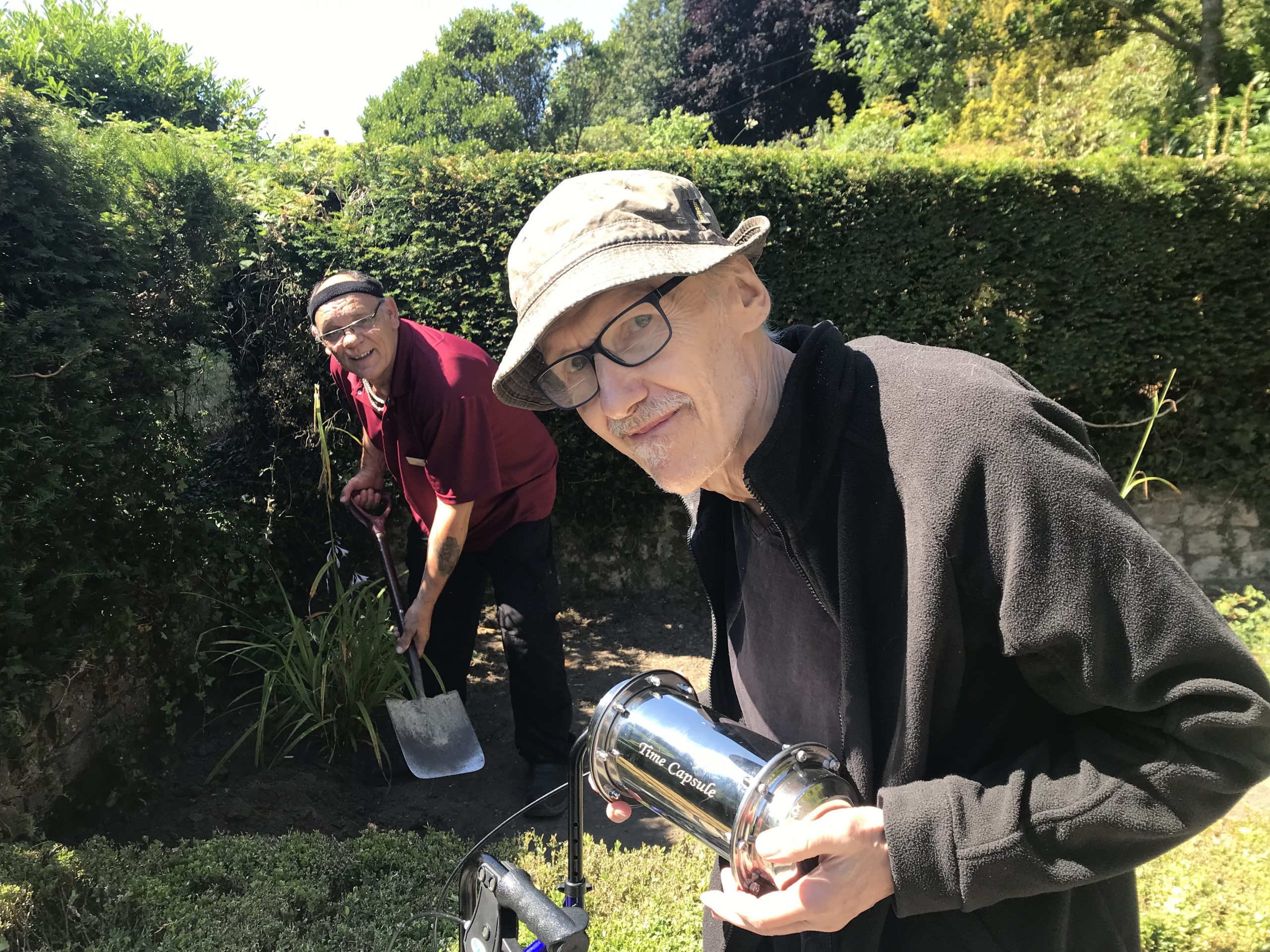 July highlights - Redcot resident and staff member burying the time capsule. 