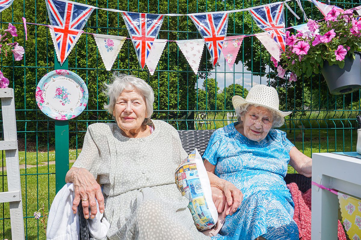 Sisters Marguerite and Adrienne at Orford House care home celebrating The Queen's Jubilee