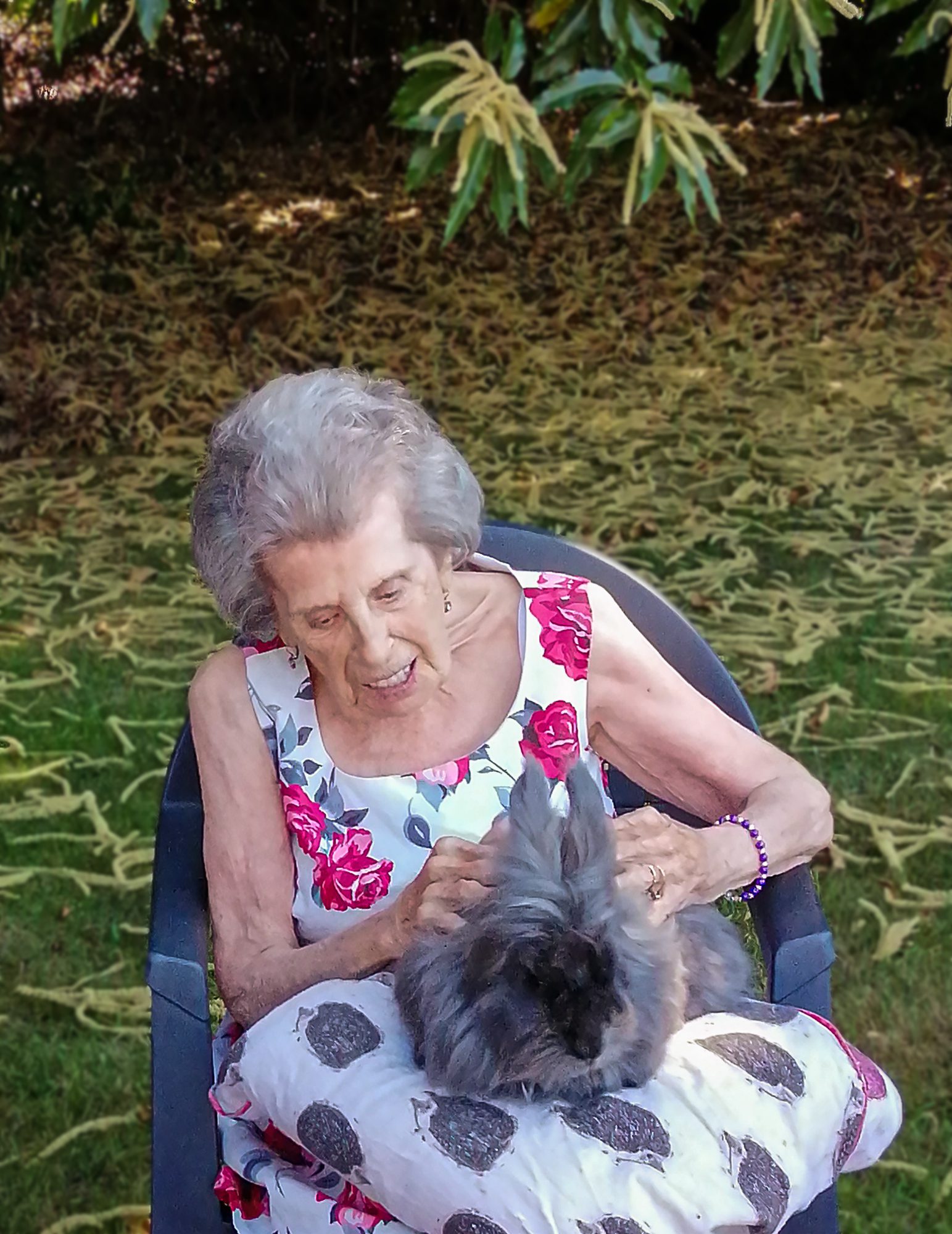 RNNH Resident with a rabbit on her lap