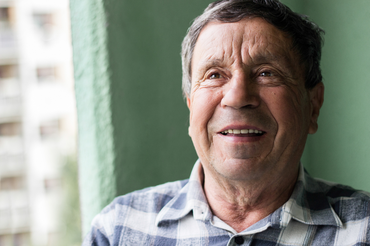A stock image of an older man smiling 