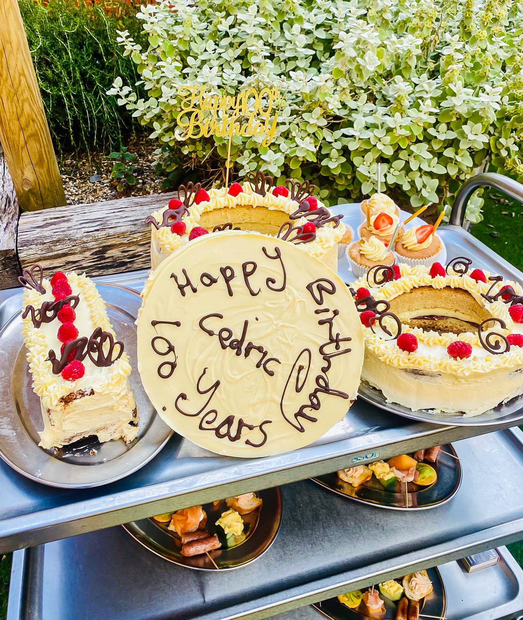 A trolley filled with cakes and birthday treats for the party. 