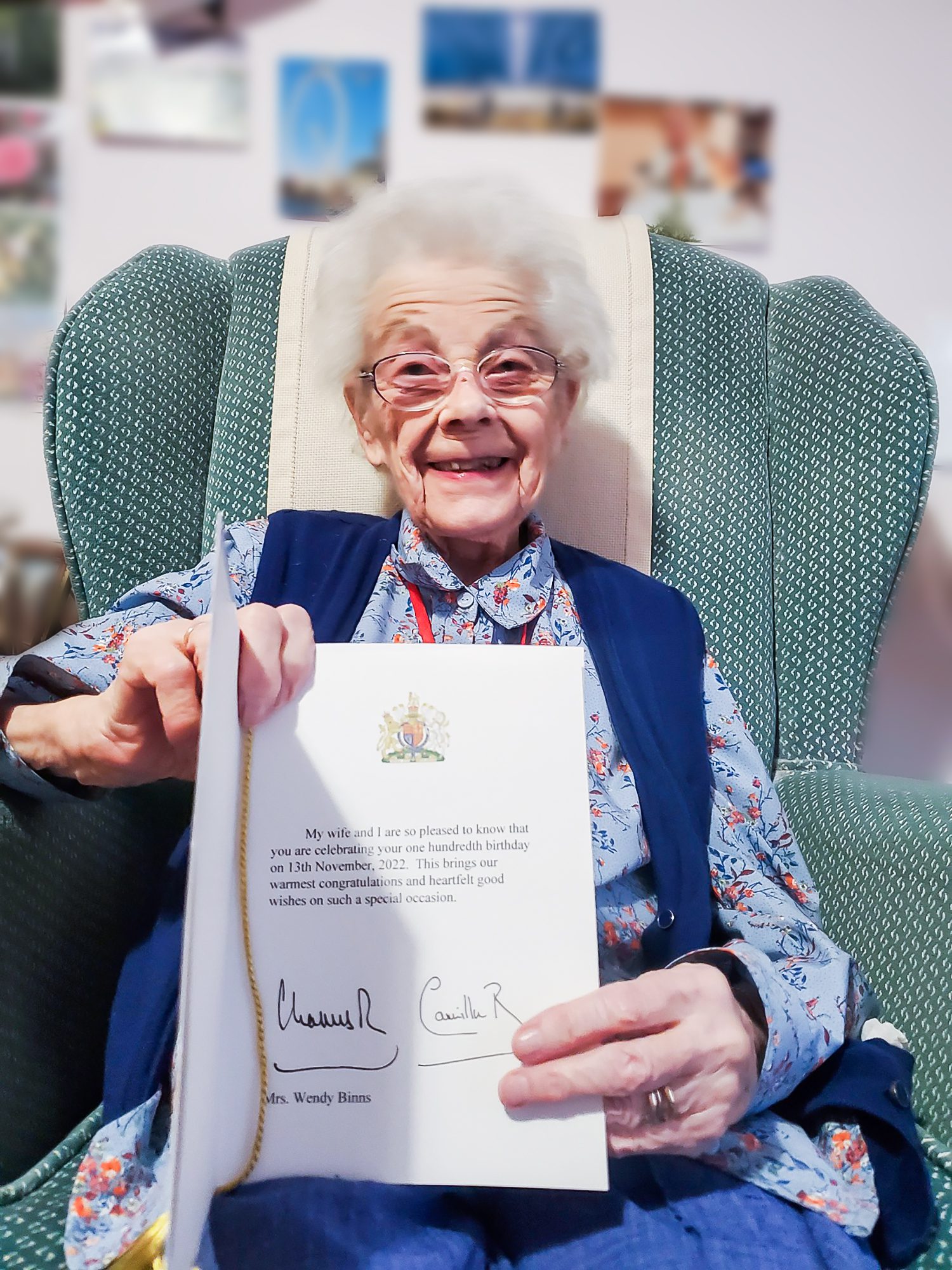 Wendy holding a card from King Charles III