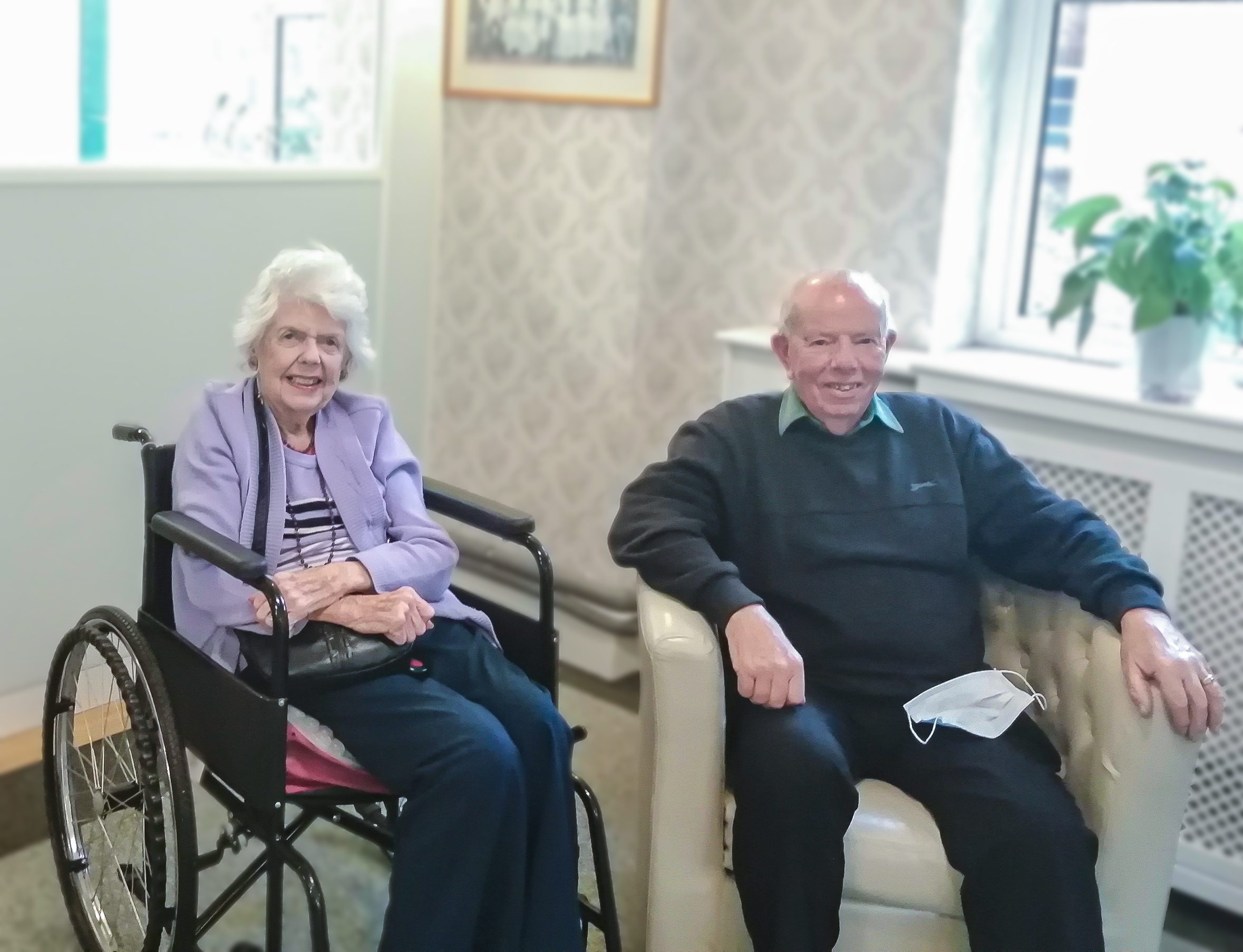George, who used to be a milk boy at RNNH, visiting his friend Janine, who was on a respite break at the care home. 