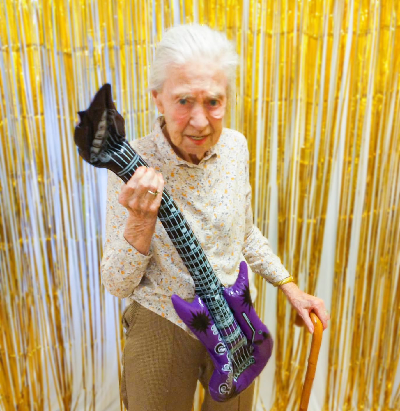 A resident from The Lawn care home playing guitar - 2023 January highlights