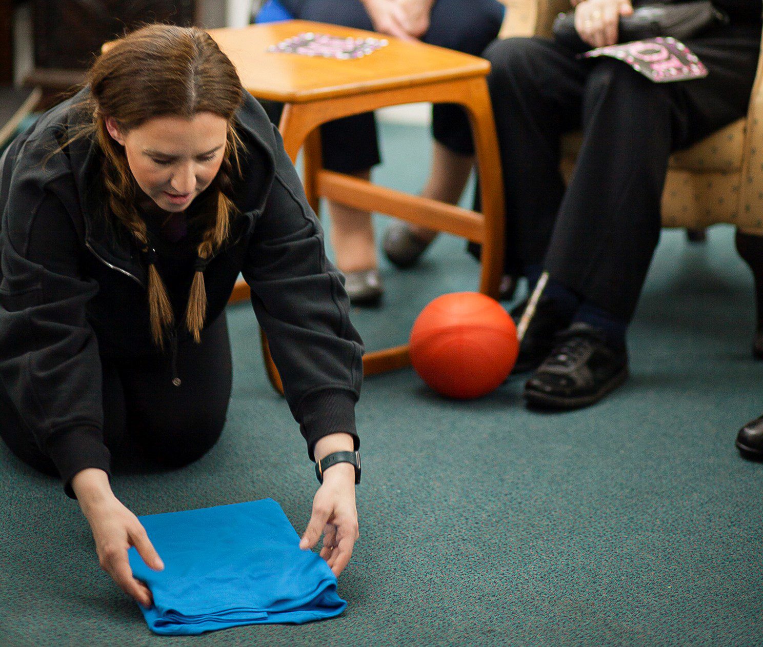 The Folding Lady at a visit to Redcot care home showing residents how to fold. 