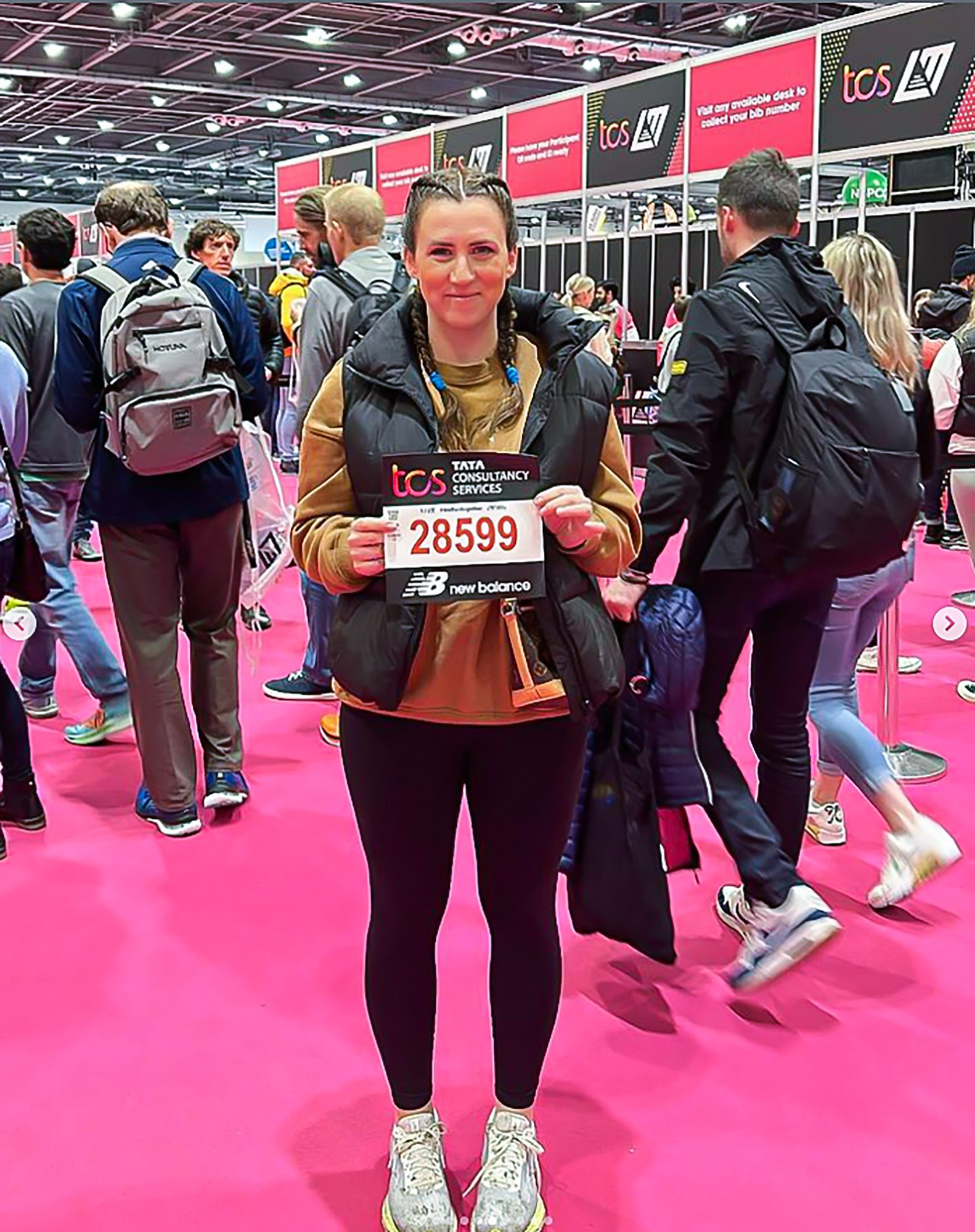 Sophie picking up her running number.