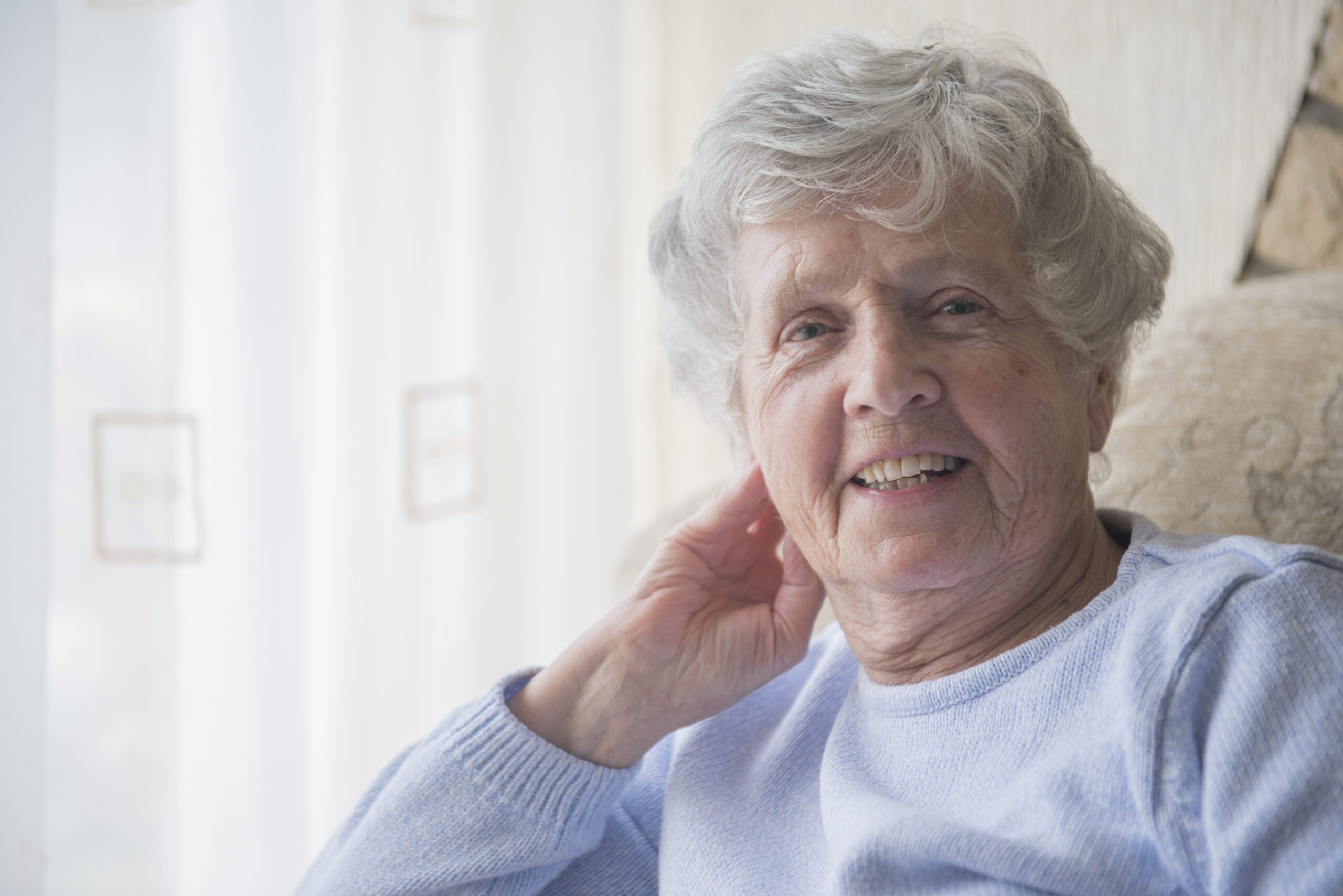 Winter Warmth Appeal 2022 - stock image of an older woman smiling.
