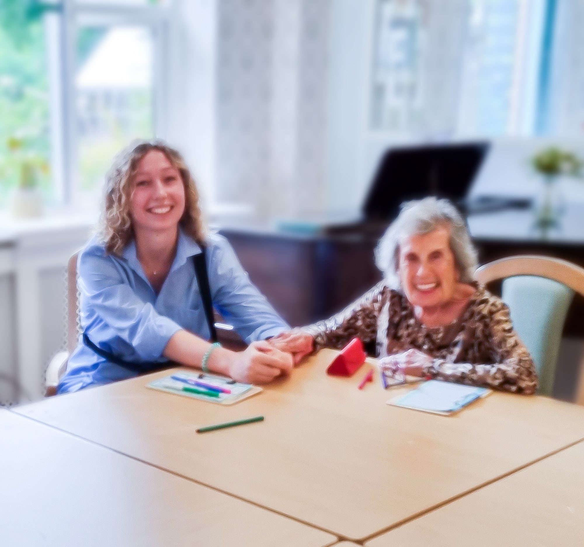 Staff member and resident playing bingo.