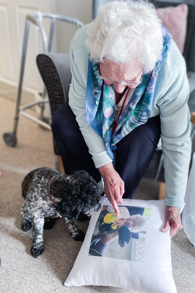 Winnie being shown Emma's cushion