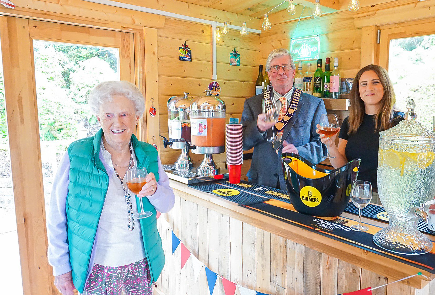 A resident, The Mayor of Haslemere and a Redcot resident enjoying the first drinks served at The Redcot Arms.