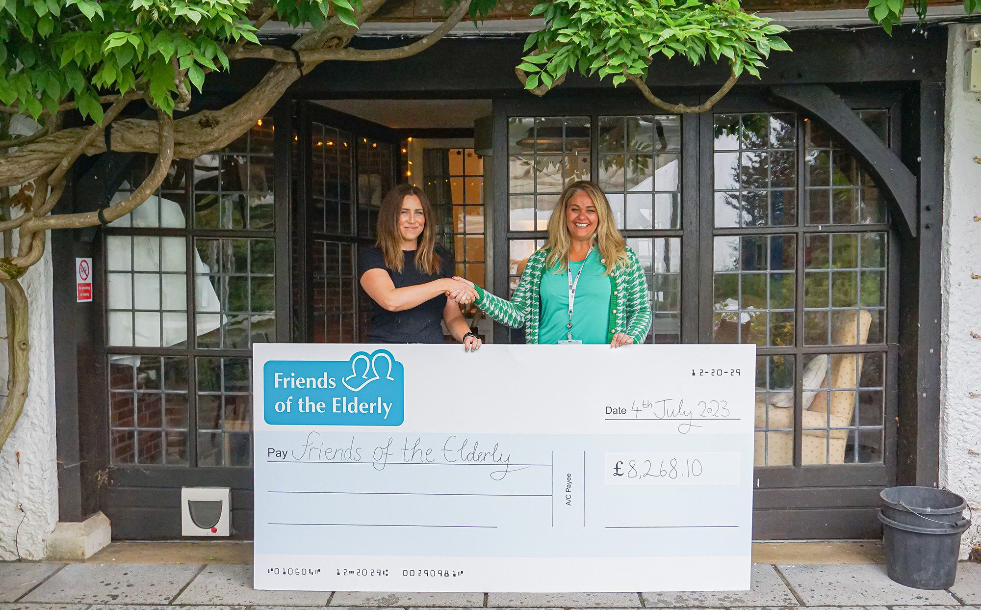 Sophie Liard presenting the cheque to Cheryl Rothschild.