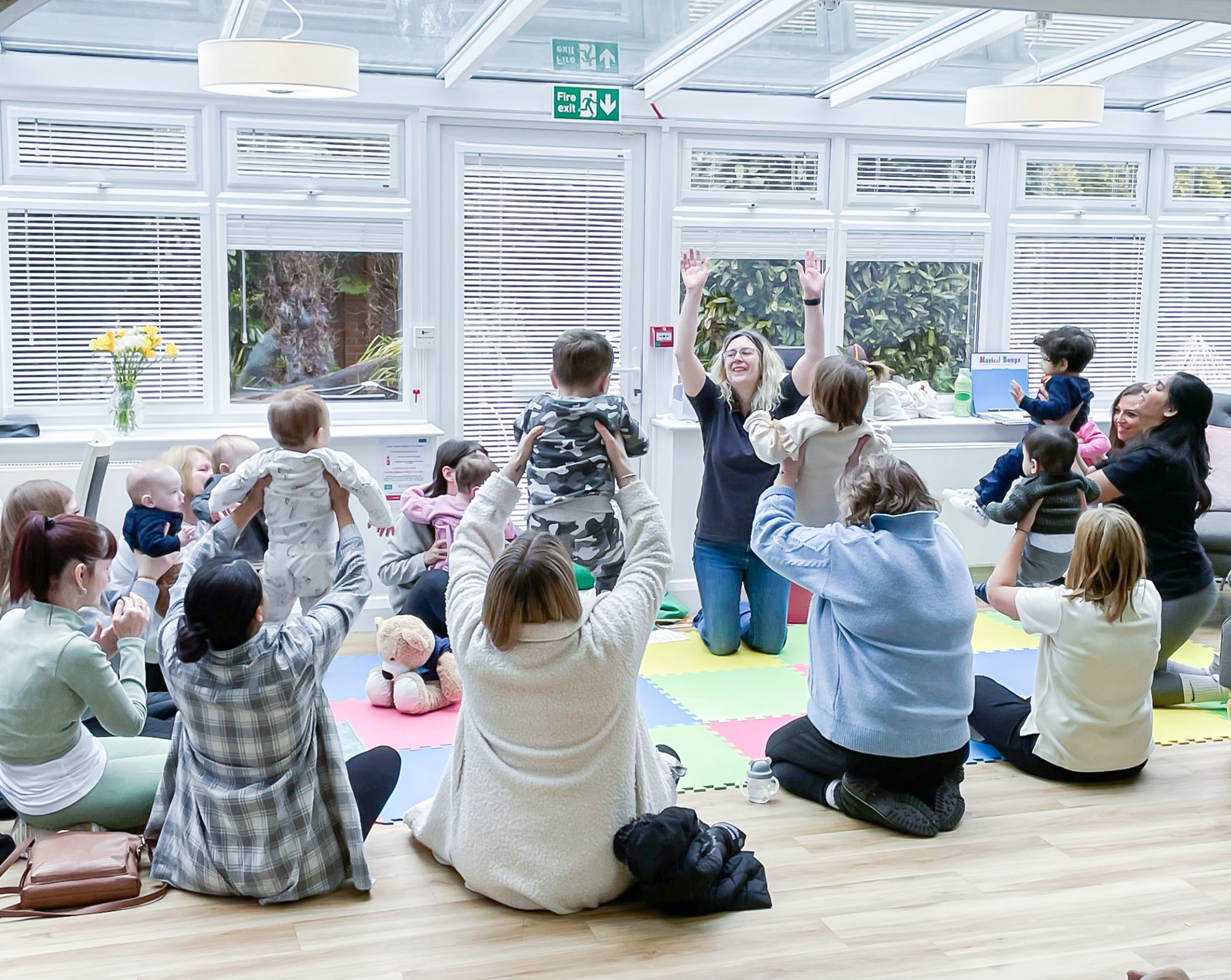 Toddlers taking part in the intergenerational Musical Bumps class