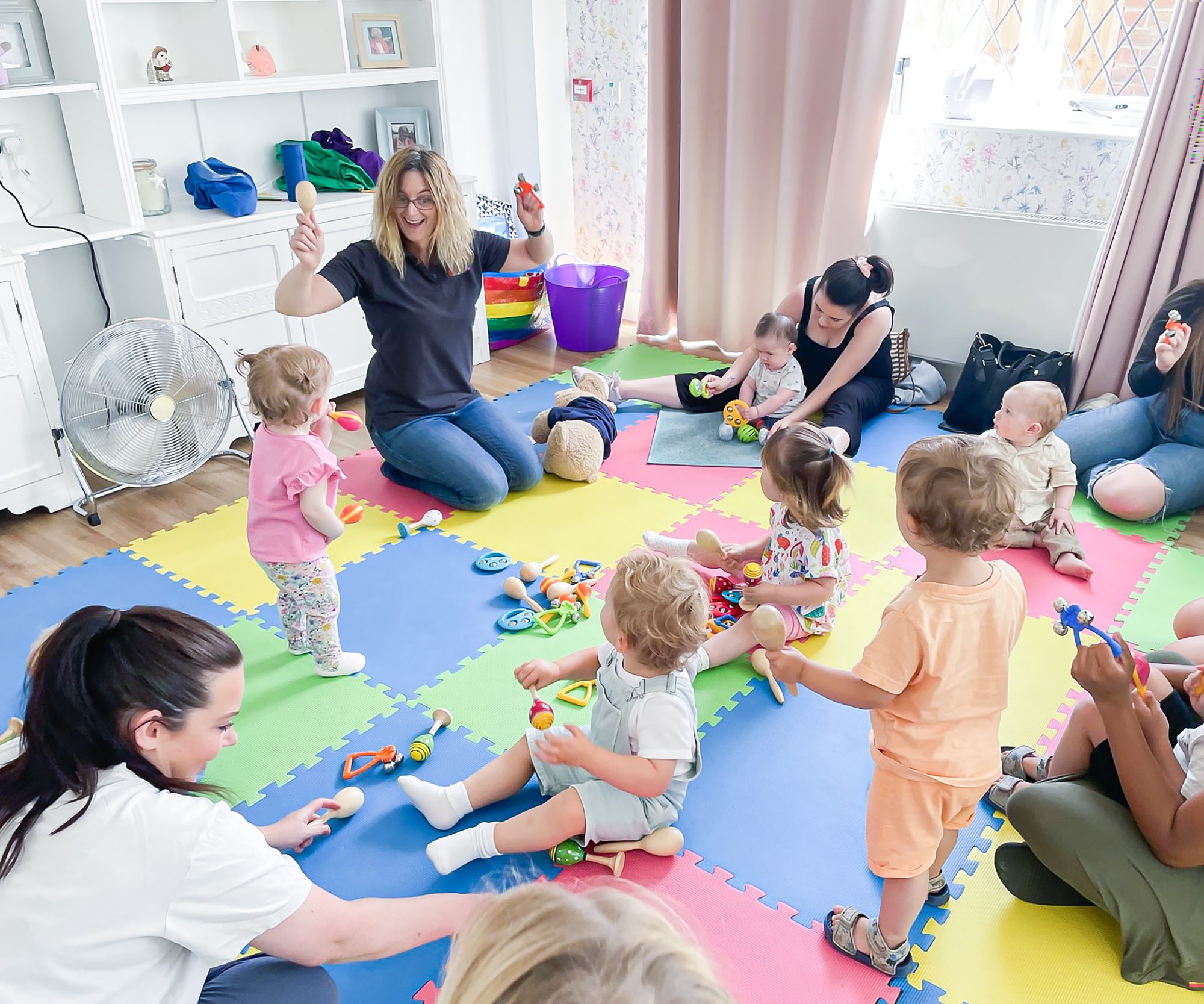 Toddlers taking part in the intergenerational Musical Bumps class