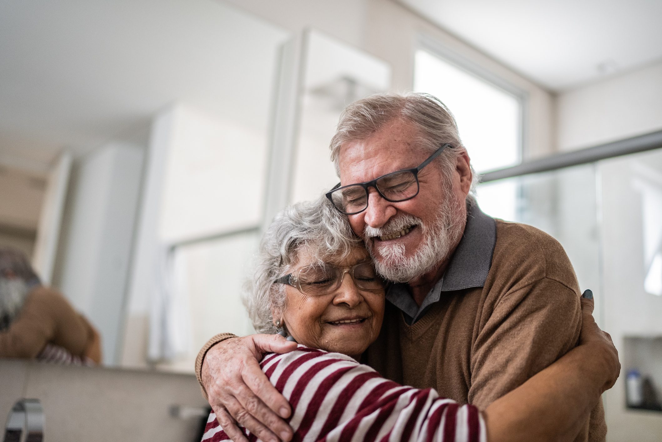 stock image of a couple embracing happily for 2023 July highlights story. 