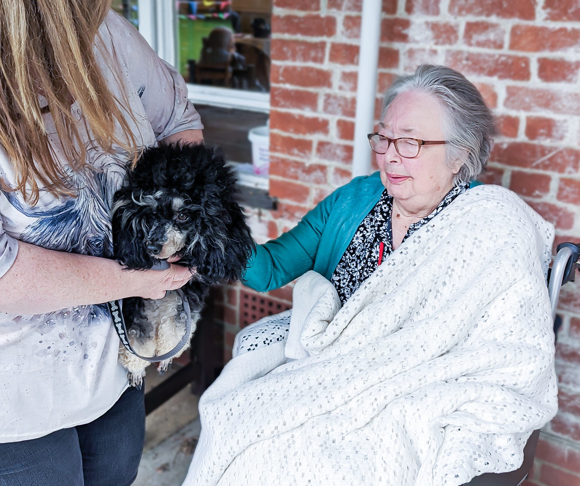 A resident saying hello to a dog.