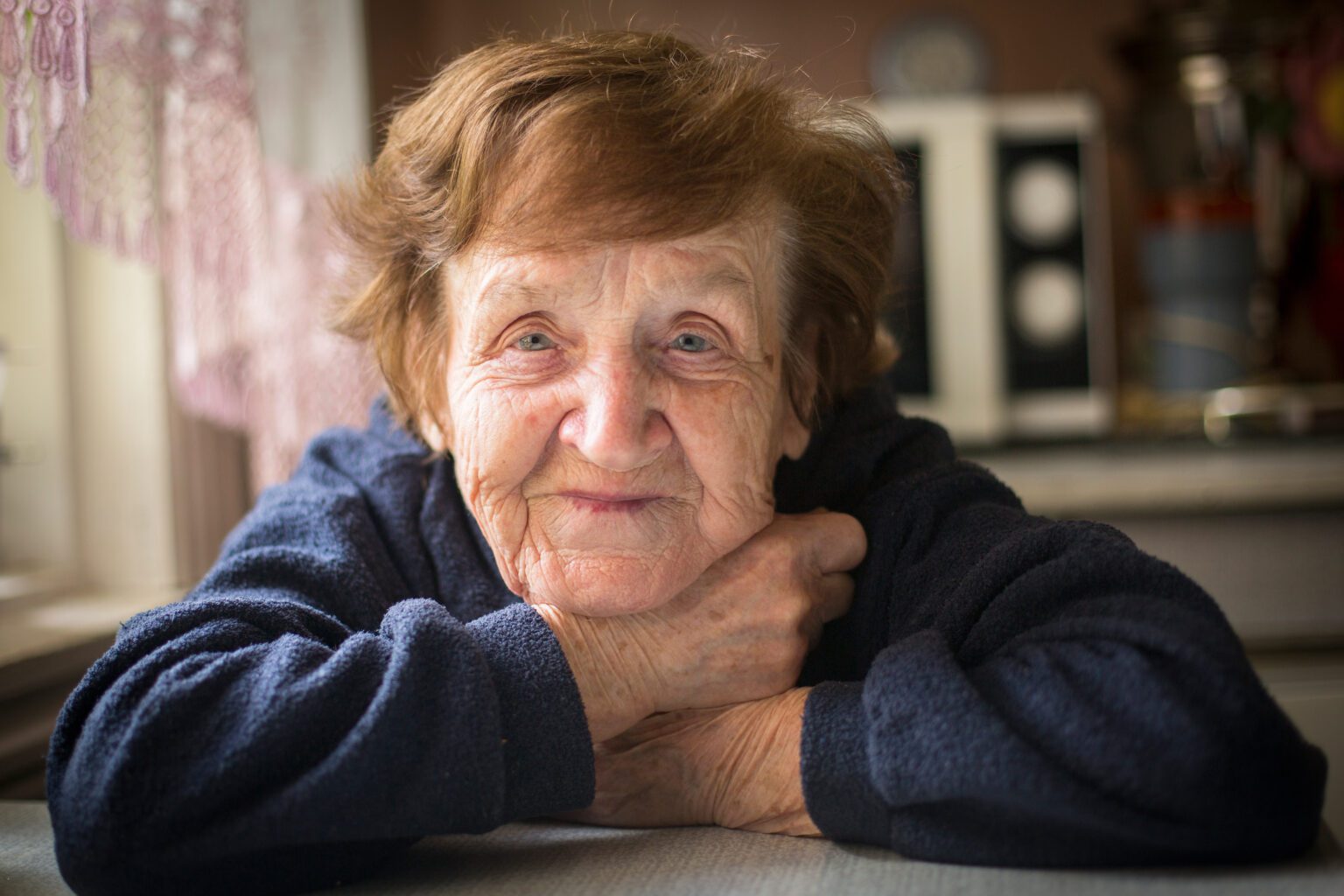 Close-up portrait of an happy old woman