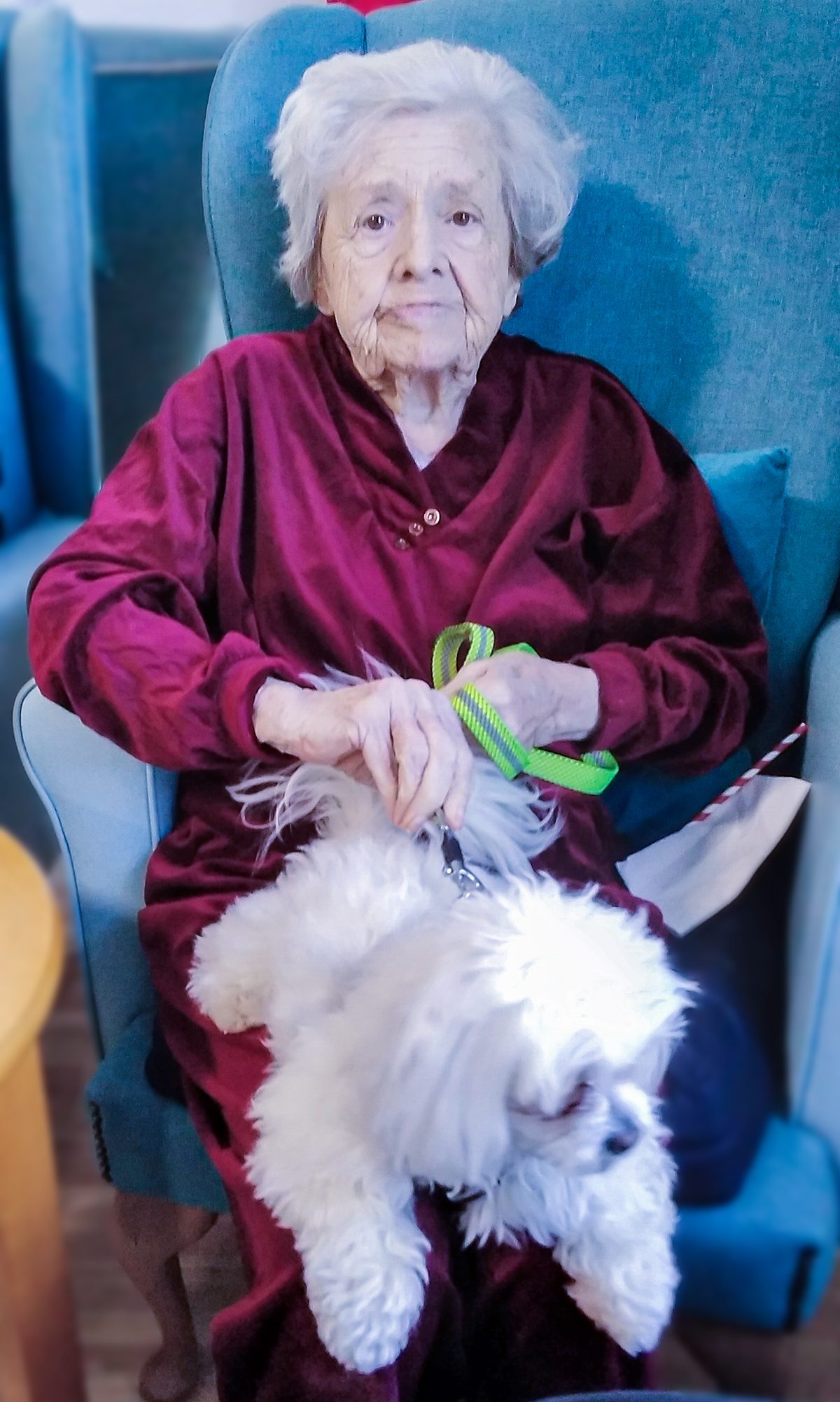 Irene with a dog on her lap.